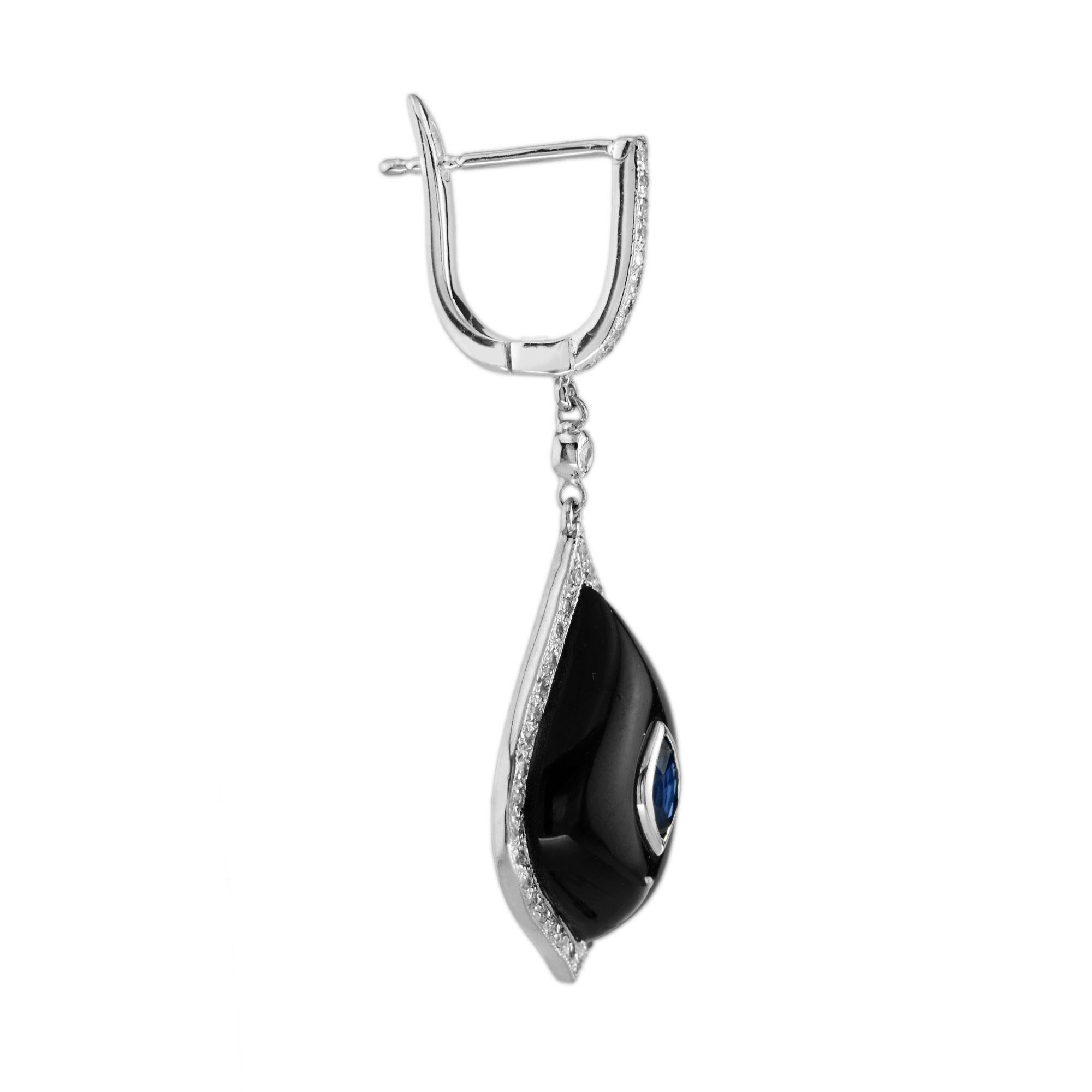 This simplicity of the black onyx together with sapphire and diamond works so well. The earrings made in 14k white gold with a center blue sapphire. The shiny black onyx surrounds the sapphire and forms marquise shape. There are 47 diamonds halo on