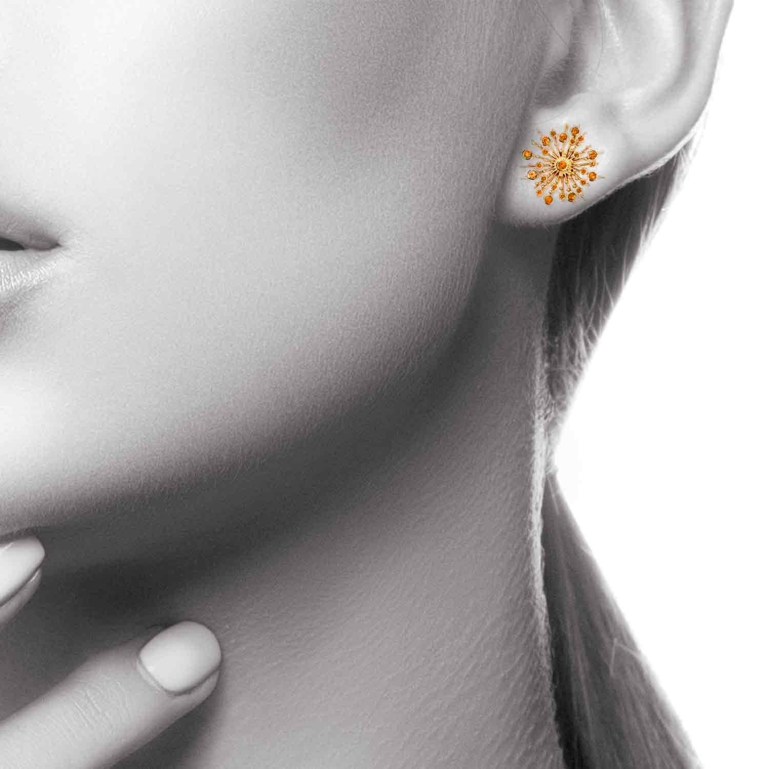 Part of the 'Soleil' collection by Natalie Barney, these stud earrings feature 48 Orange Sapphires with a total weight of 0.47 carats. The matching pendant is available.

Made in 9 carat yellow gold.  Please request the video for an even closer view
