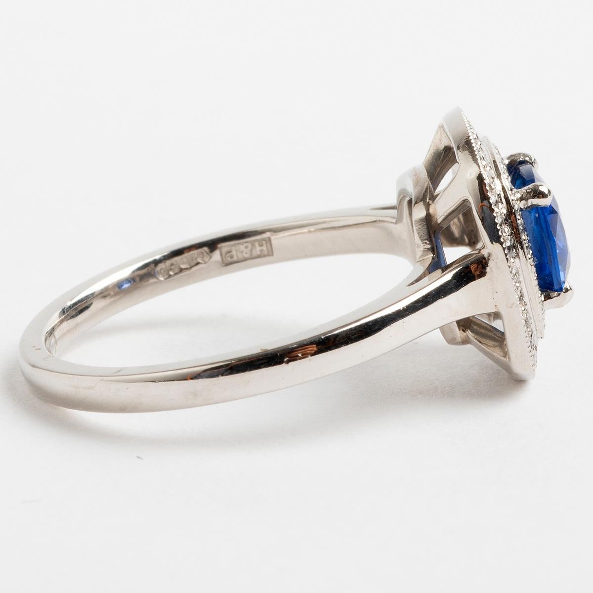 A fabulous platinum set halo ring, centred with a large extremeley high quality sapphire (est 1.04carat) and surrounded by pave diamonds in a double halo setting (est. .19 carat total) this would make for the ultimate statement ring. The ring size