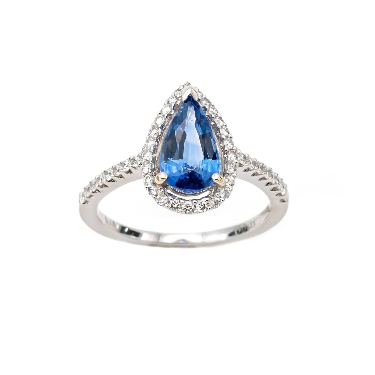 This stunning sapphire and Diamond ring is so pretty.!! The Pear shape sapphire is 1.7 ct and the total weight of the diamonds surrounding 0.36 tw. The setting is 18k white gold and the size of the ring is size 6 1/4 and can be sized to fit your