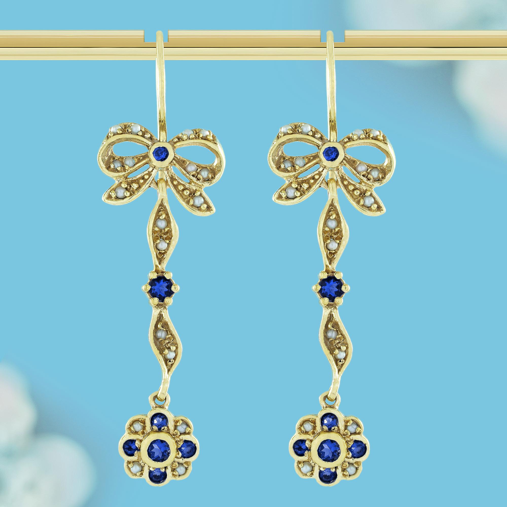 These captivating earrings feature a bow design at the top, with a stunning natural sapphire at its center, exuding timeless elegance. The flowing ribbon beneath the bow, twisting gracefully like a bow's tail, is accented with additional sapphires,
