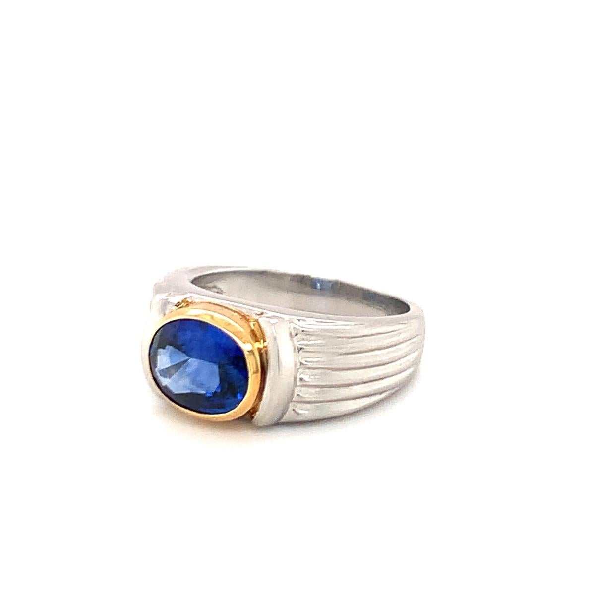 Oval Cut Sapphire Platinum and Yellow Gold Ring, circa 1990s For Sale