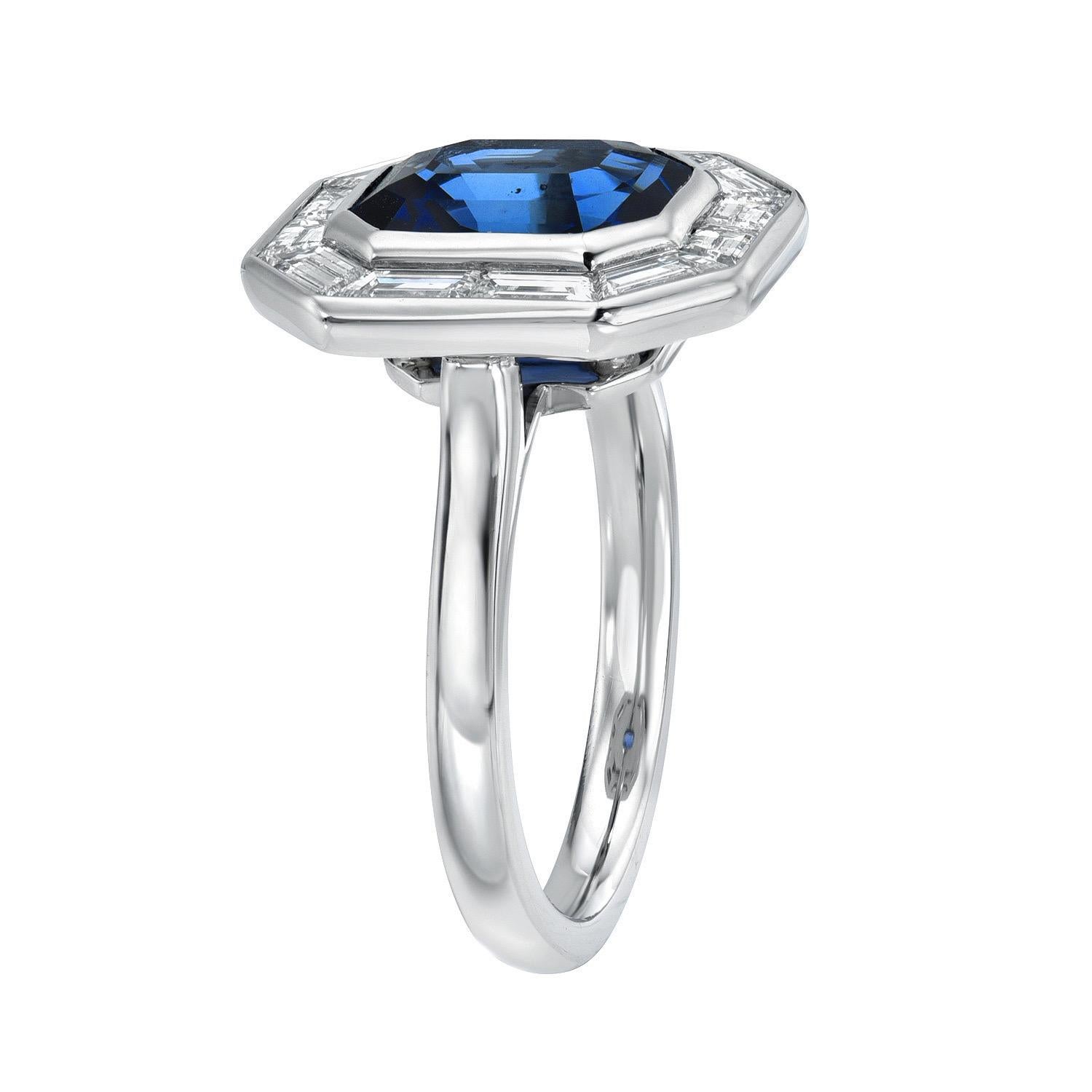 Classic 3.54 carat Blue Sapphire Emerald Cut, platinum ring, framed with a total of 0.95 carat Trapezoid diamonds F/VS.  
Ring size 6. Resizing is complementary upon request.
The GIA gem report is attached to the image selection for your