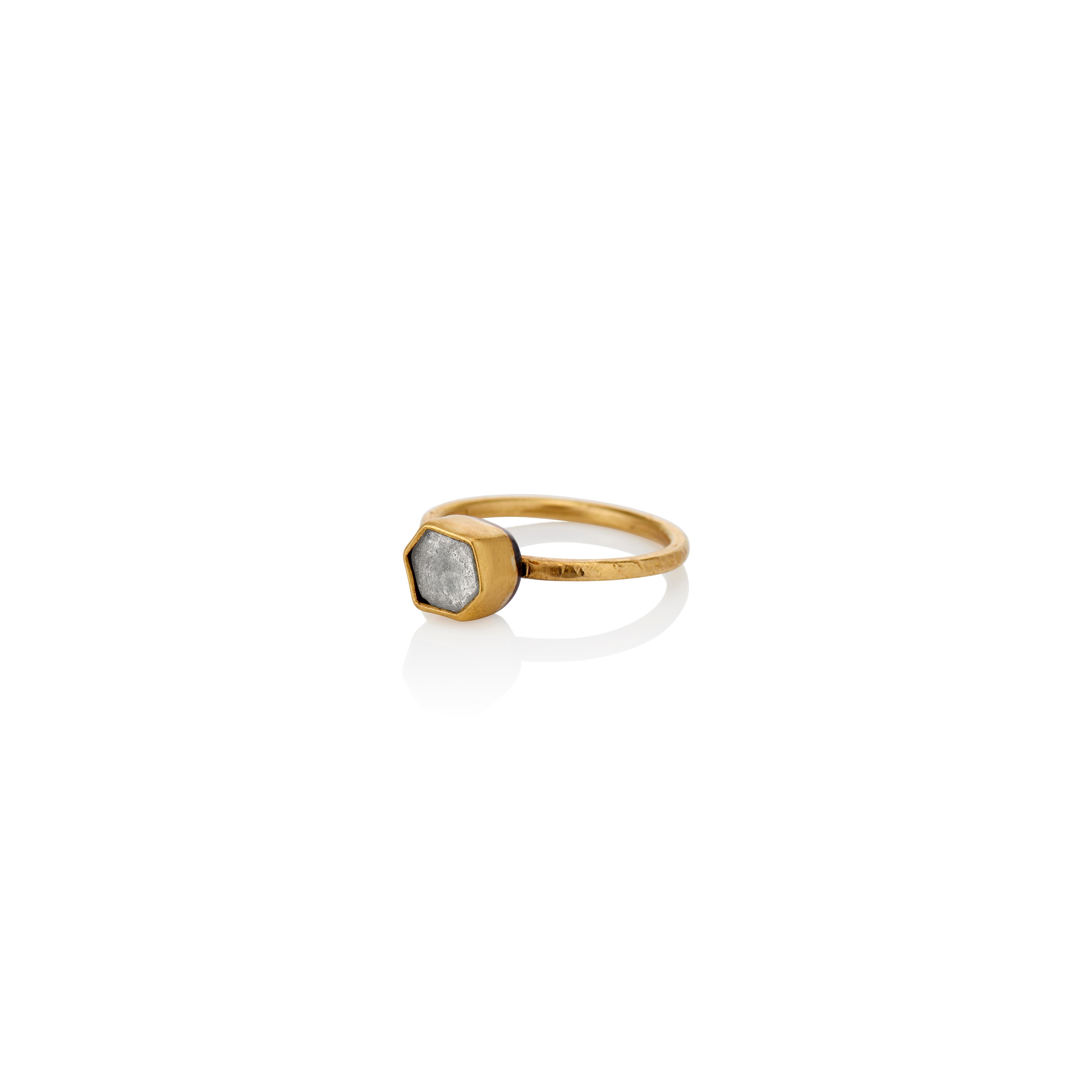 Heather gray sapphire rose cut crystal (1.33 carats) solitaire is encased in a 22 karat yellow gold bezel. The 1.5mm ring shank of 20 karat yellow gold is size 6.75.  The back sheet of the bezel is made in Sterling silver and oxidized to lend the