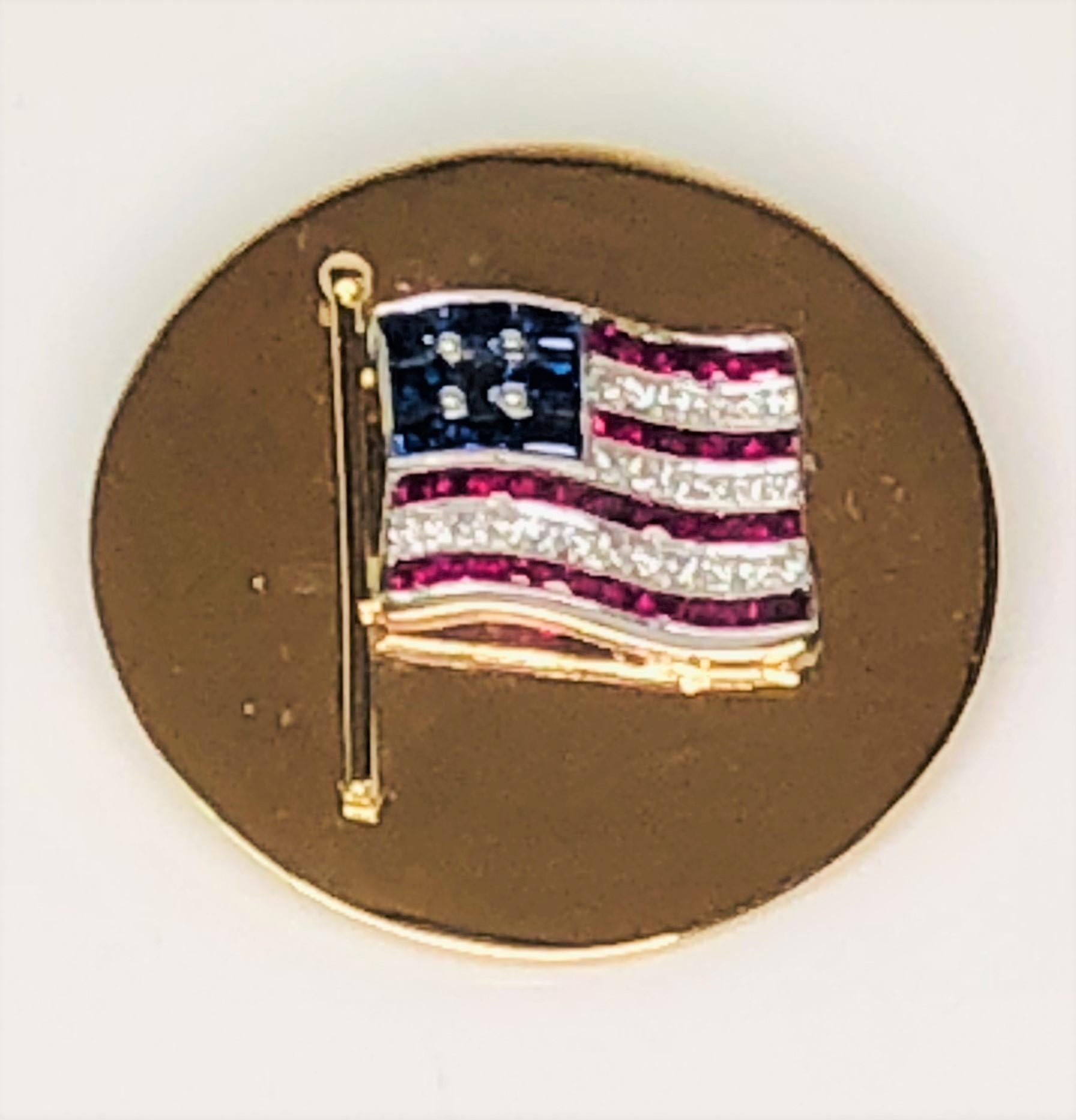This beautiful platinum gemstone flag is soldered to a yellow gold disk that really grabs attention!  
Platinum flag has:
     24 full cut round diamonds, approximately .24 tdw, SI1 clarity, H-I color.
     9 square step cut medium dark strong blue