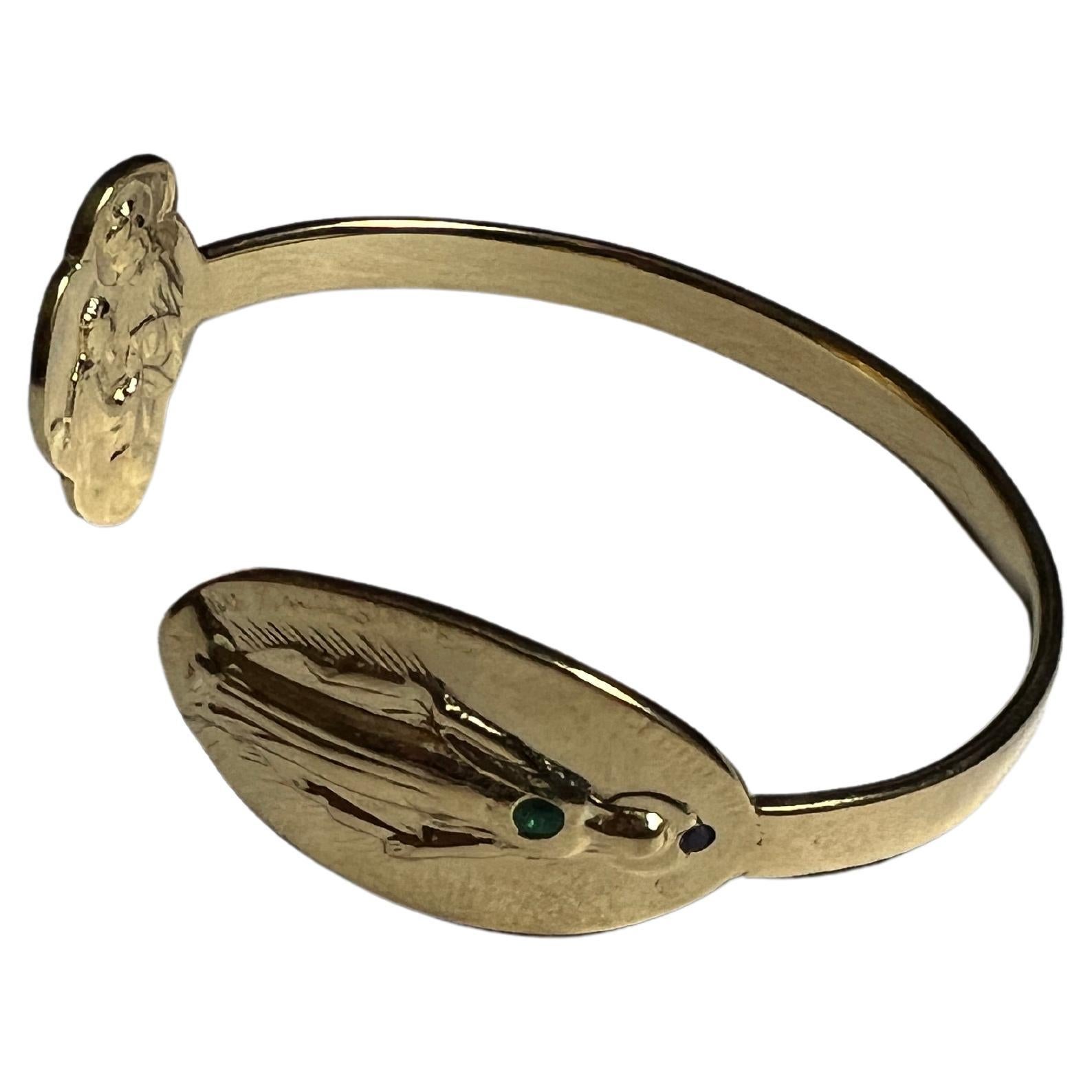 Emerald Ruby Virgin Mary Bangle Bracelet Cuff Gold Plated 
Size Small/Medium

Designer: J Dauphin

Symbols or medals can become a powerful tool in our arsenal for the spiritual. 
Since ancient times spiritual pendants, religious medals has been used