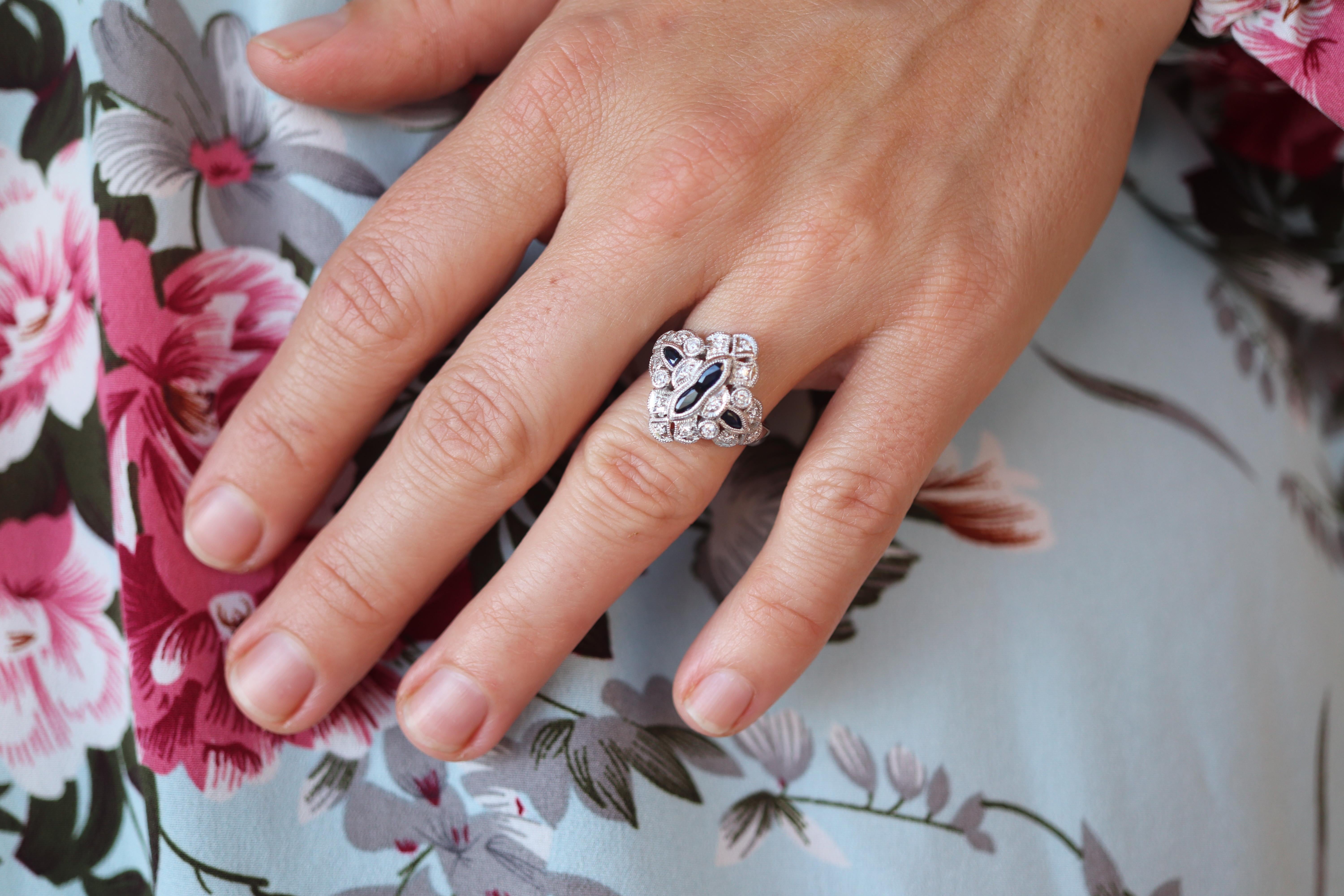 Art Deco Style Shield Ring.

Sapphire and Diamond bezel set into Platinum.

Details:
8.8grams
0.60ctw Natural Sapphire,
0.24ctw Diamonds
Size 5.25

Appraised at $2400. Appraisal is attached and included.