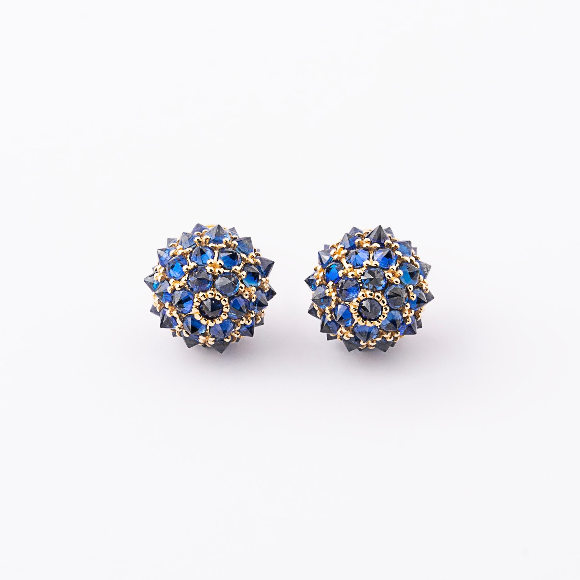 Sapphire gemstone earrings in 18k gold.  Extraordinary design with attention to detail. Exclusively available at our store only.  
Diameter size: 1.4cm diameter 
Specially cut 2.7mm diameter brilliant natural blue sapphires from Africa. Stone