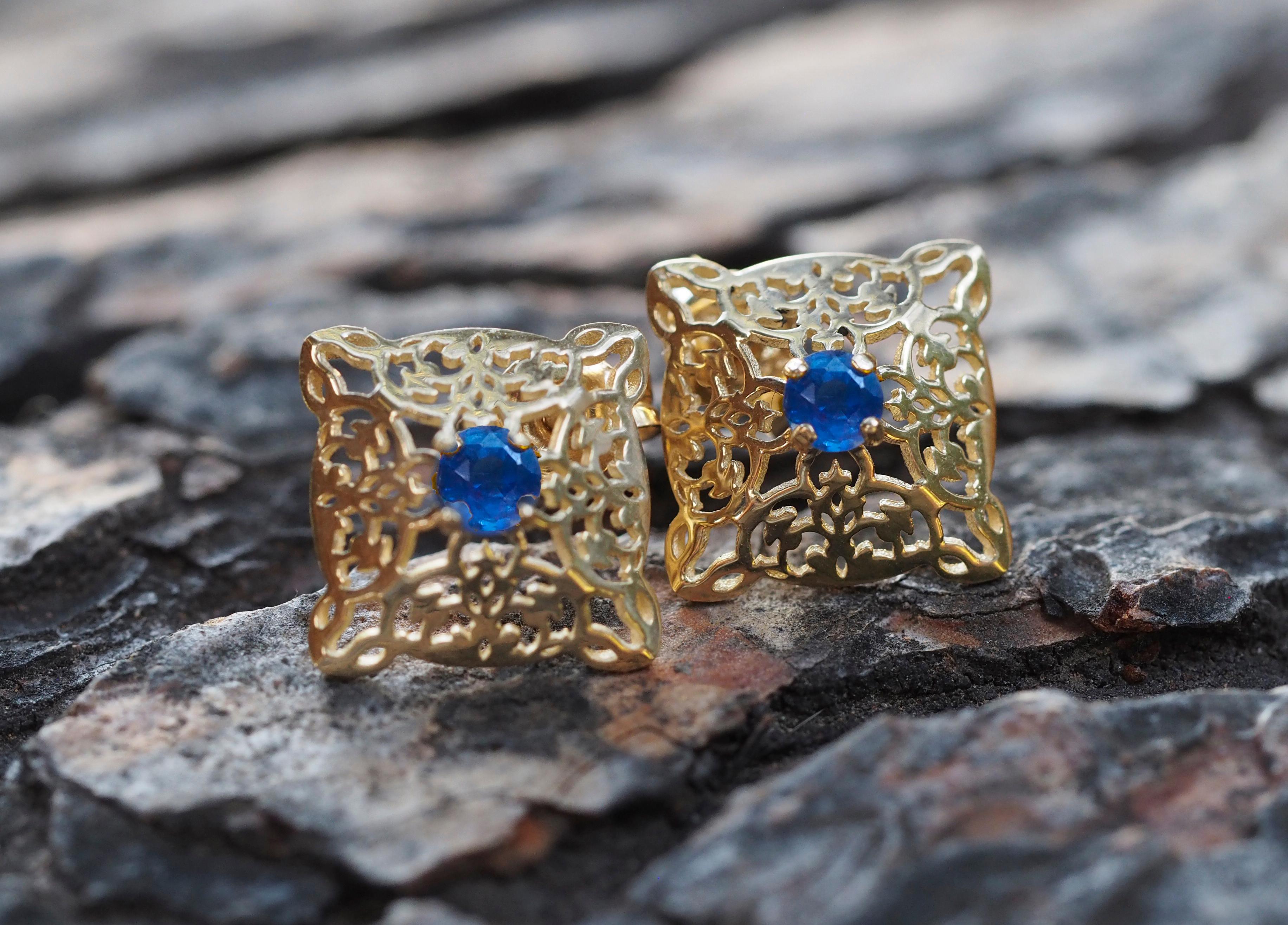 Sapphire stud earrings in 14 k gold. 
Vintage sapphire earrings. Oriental earrings studs. Natural sapphire studs. Round blue sapphire studs.

Metal: 14k gold.
Weight: 2.0 g.
Size 16 x11.5 mm.

Set with sapphires - 2 pieces, color - blue
round cut,