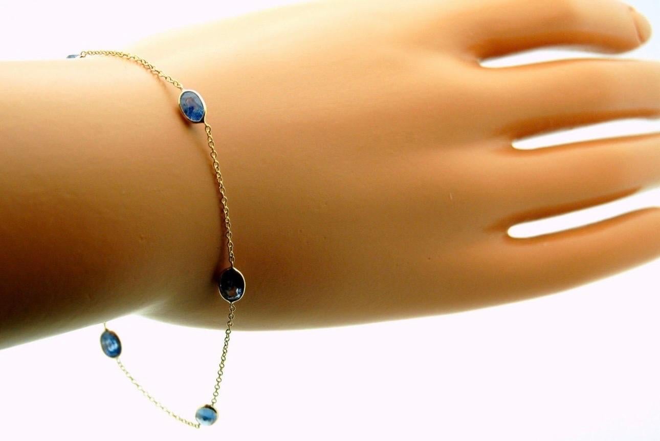Modern sapphire bracelet in 14KT yellow gold, simple and elegant featuring sapphires oval size 6x4mm on a sterdy link chain, extention on 6.5