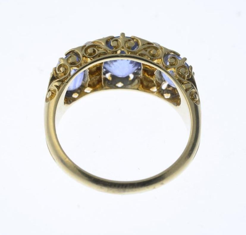 BERNARDO ANTICHITÀ PONTE VECCHIO FLORENCE
The graduated oval-shape sapphire line, with old-cut diamond line spacers and scrolling gallery. Estimated dimensions of principal sapphire 8 by 6.5 by 4.7mms. Estimated total diamond weight 0.25ct. Ring