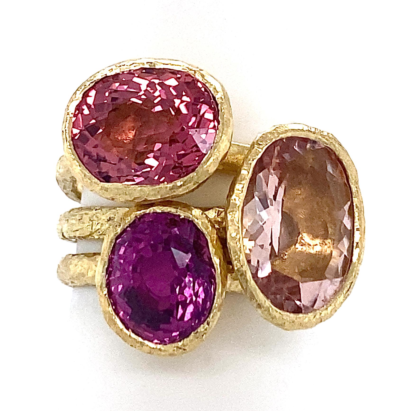 Three different stones offer up three different ways to THINK PINK in this spectacular stacking set by Eytan Brandes.  

All three rings are hand-crafted in rich 18 karat yellow gold by Eytan  and feature a satiny, hammered finish and martini glass
