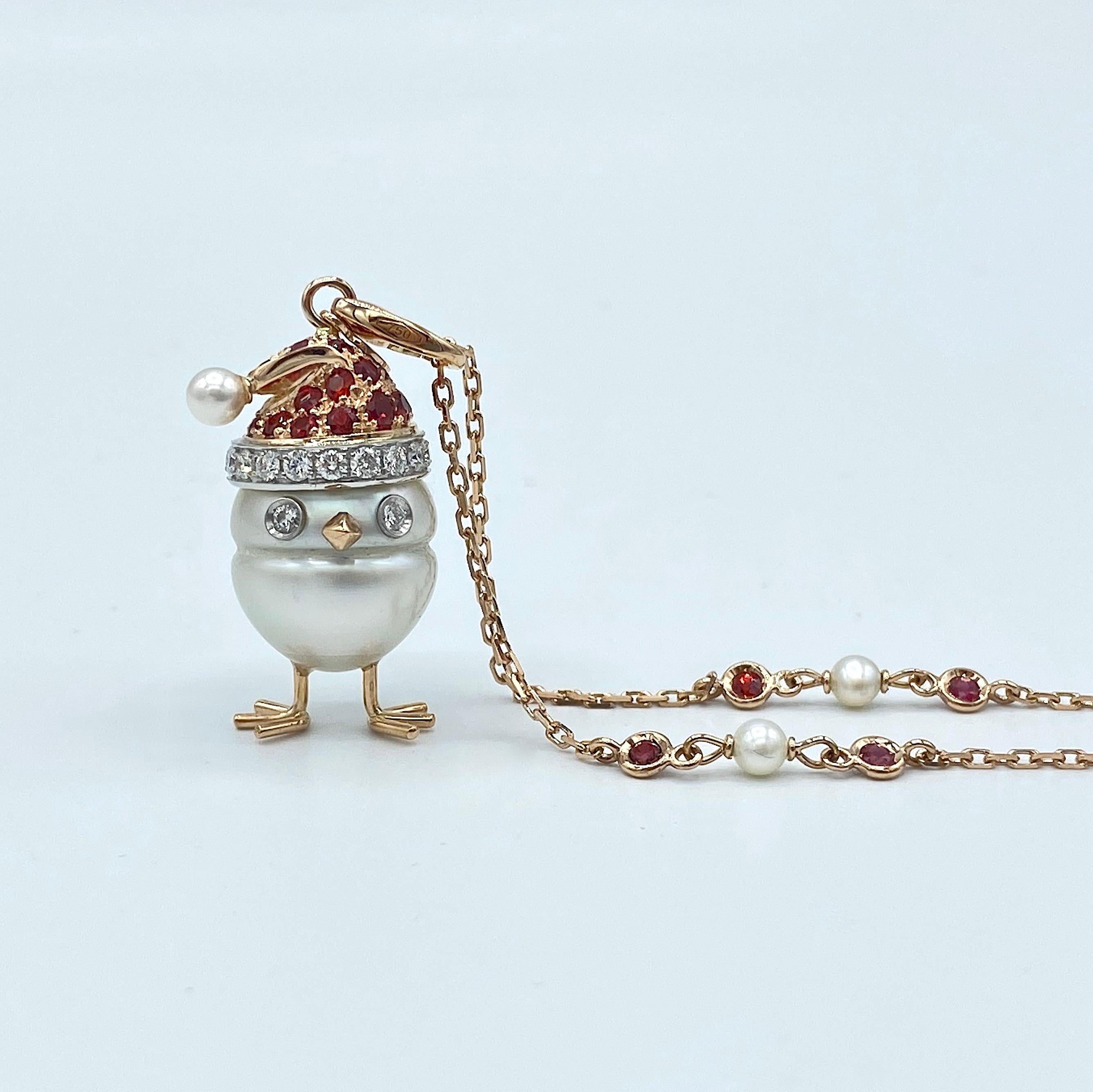 This fantastic pendant made with a beautiful and large Australian pearl of about 13x16 cm. It is an original, unique and precious jewel suitable especially for the Christmas period.
The hat is made white and red gold set with ct 1,00 of red