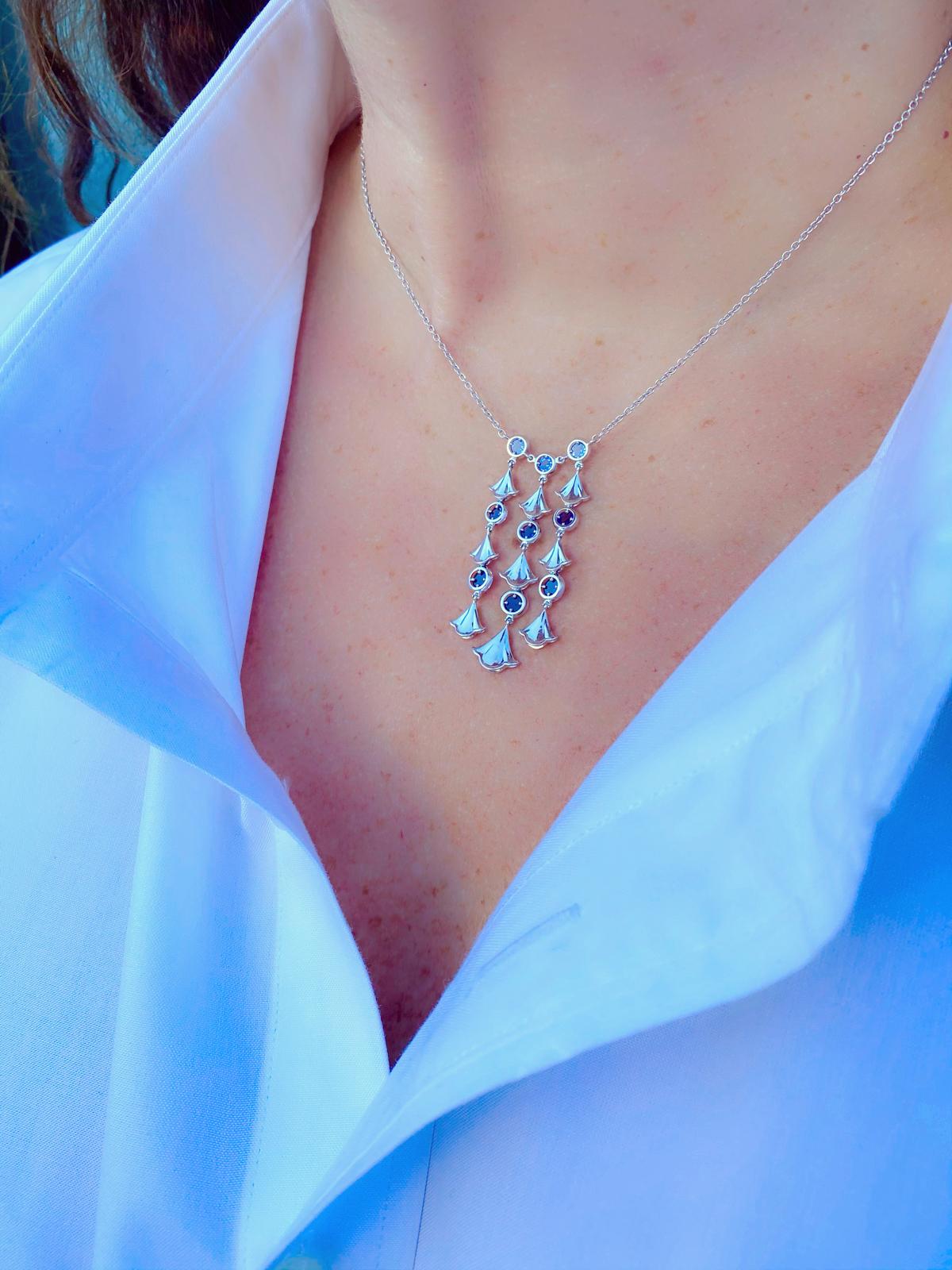 This elegant drop necklace will accent any outfit! By Marina B. of the famed Bulgari family, the 18k white gold pendant-necklace is designed with ginko leaf links alternating with rose-cut sapphire links, with a total sapphire weight of 1.62 carats.