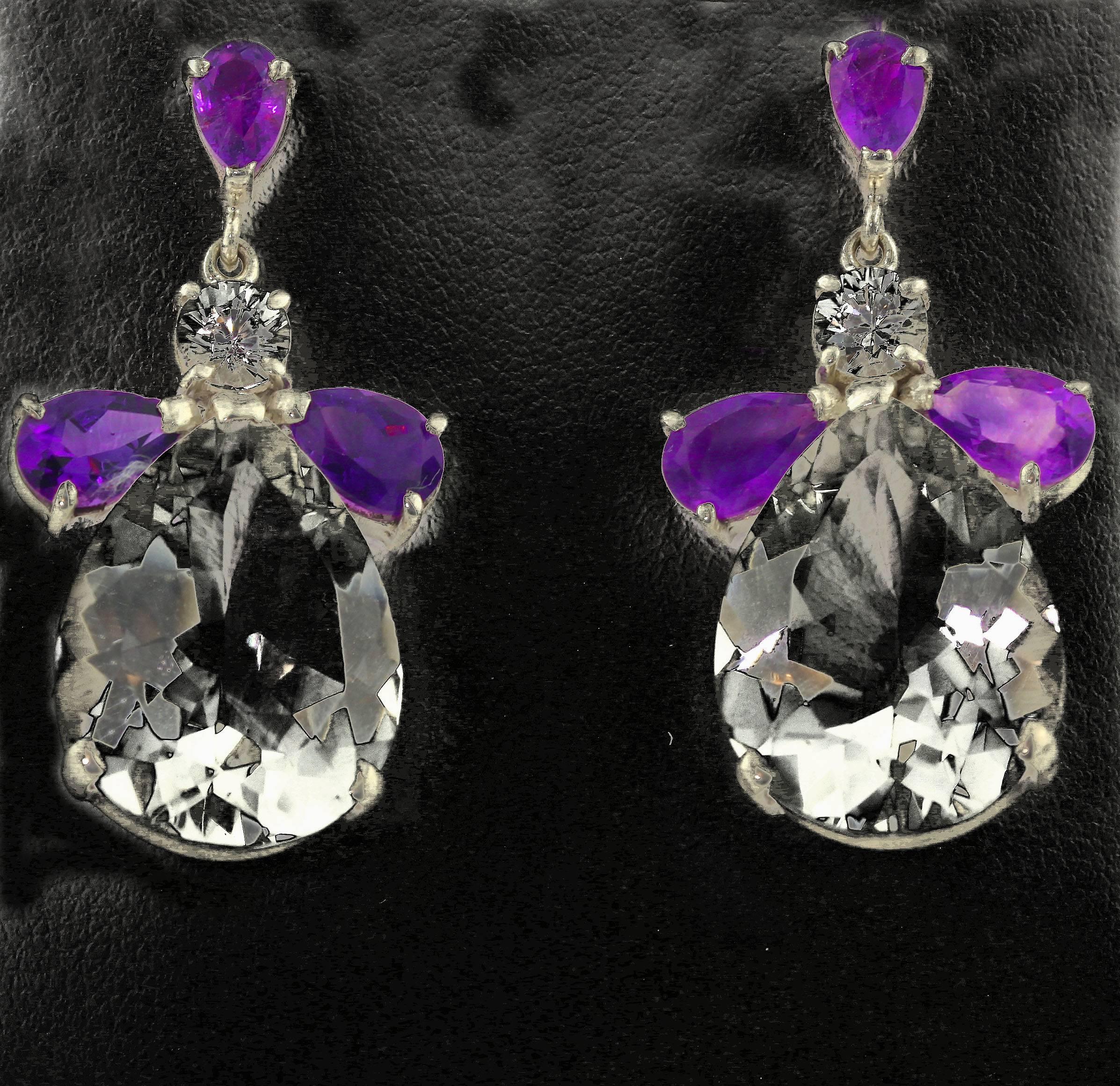 Brilliant pear cut Amethysts show off these lovely round Sapphires (5 mm) dangling with 17 carats (20.7 mm x 15 mm) of glittering white silvery translucent pear cut Quartz set in sterling silver stud earrings. They hang approximately 1.43 inches.