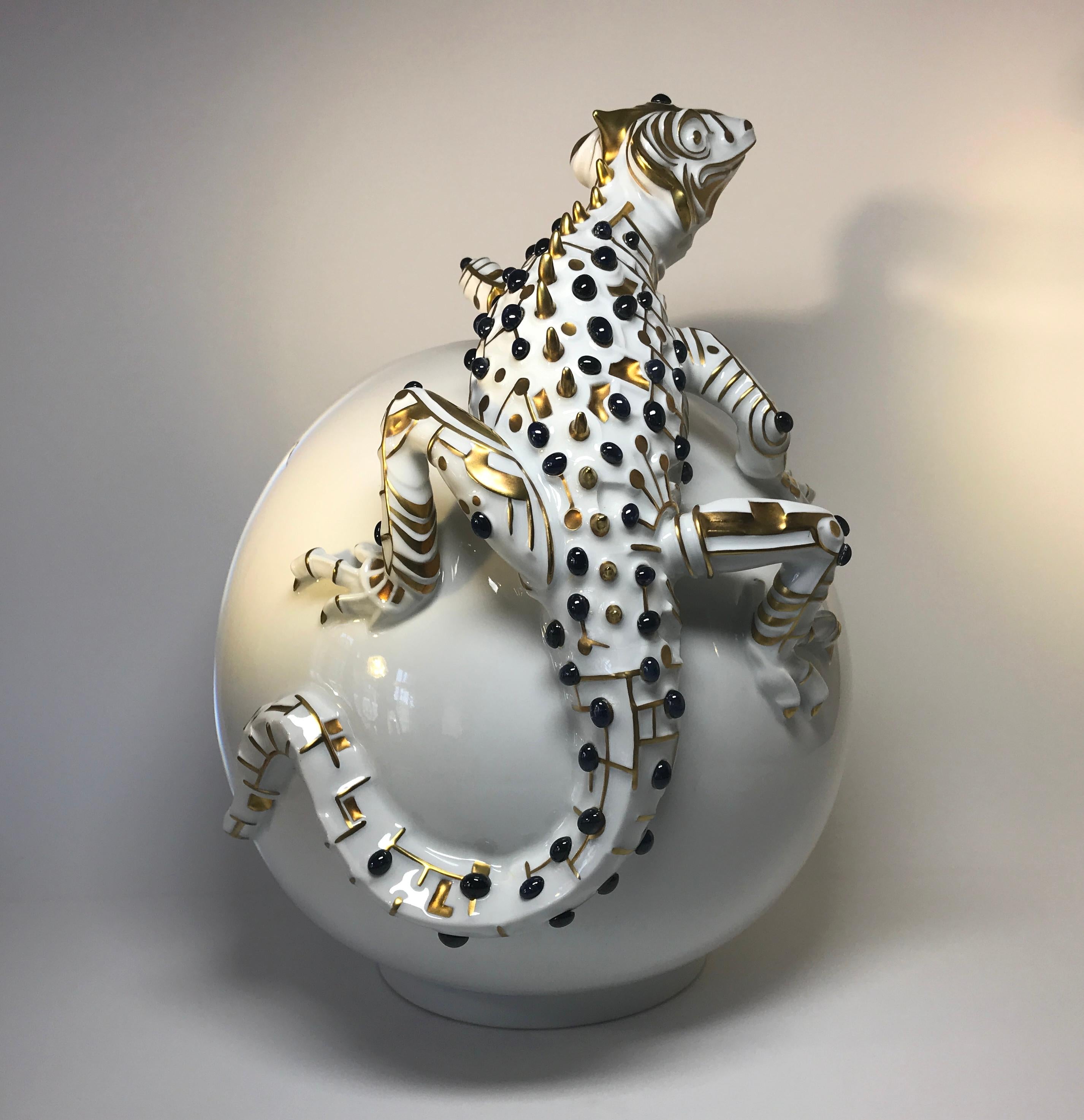 Splendid and unique 24-karat pure gold and sapphire set lizard caviar bowl
88 cabochon sapphires and 24-karat pure gold decorate this impressive lizard sculpture that sits atop a hatched white porcelain egg
Designed and created by Jiri Lastovicka