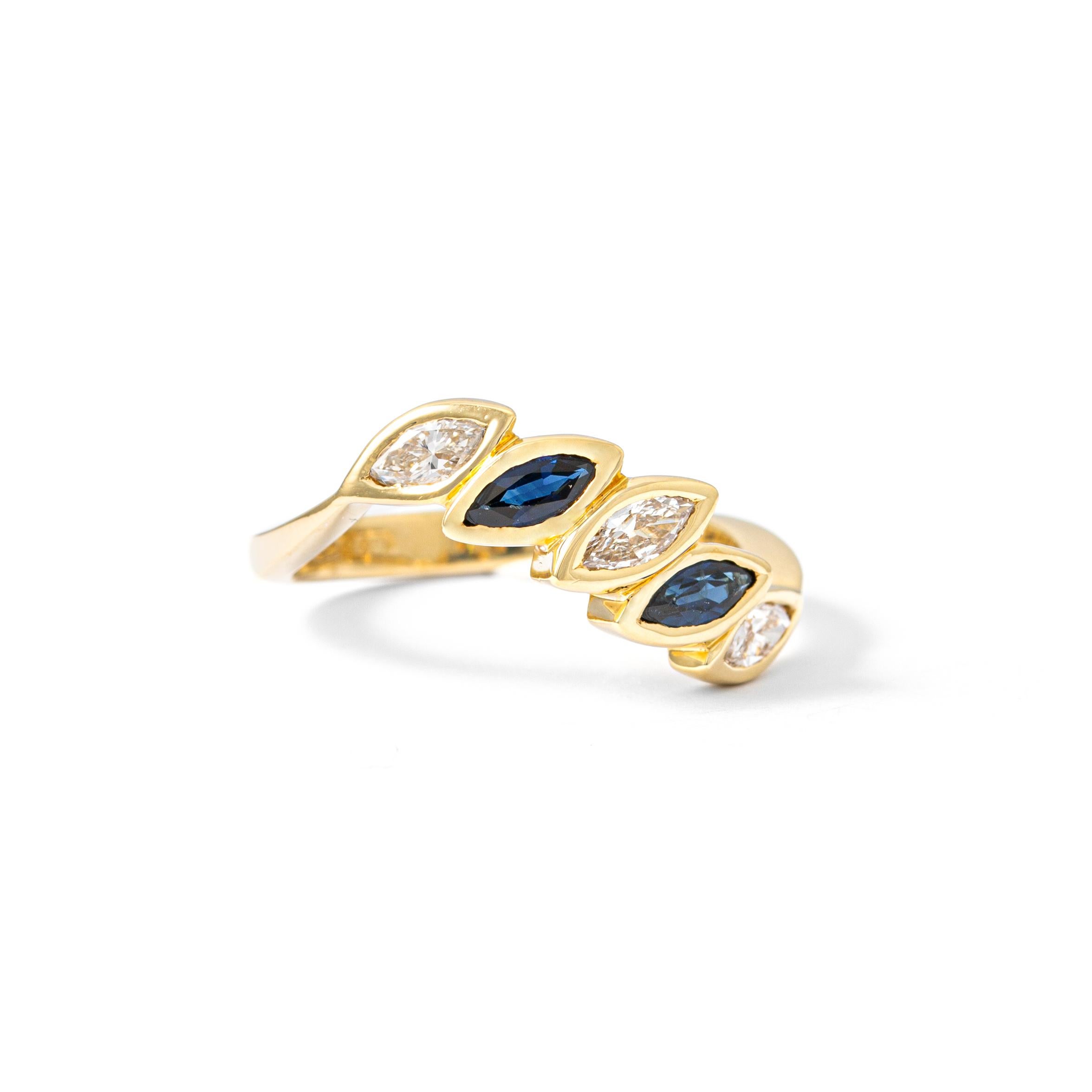 Ring in 18kt yellow gold set with 2 marquise cut sapphires 0.55 cts and3 marquise cut diamonds 0.51 cts Size 53