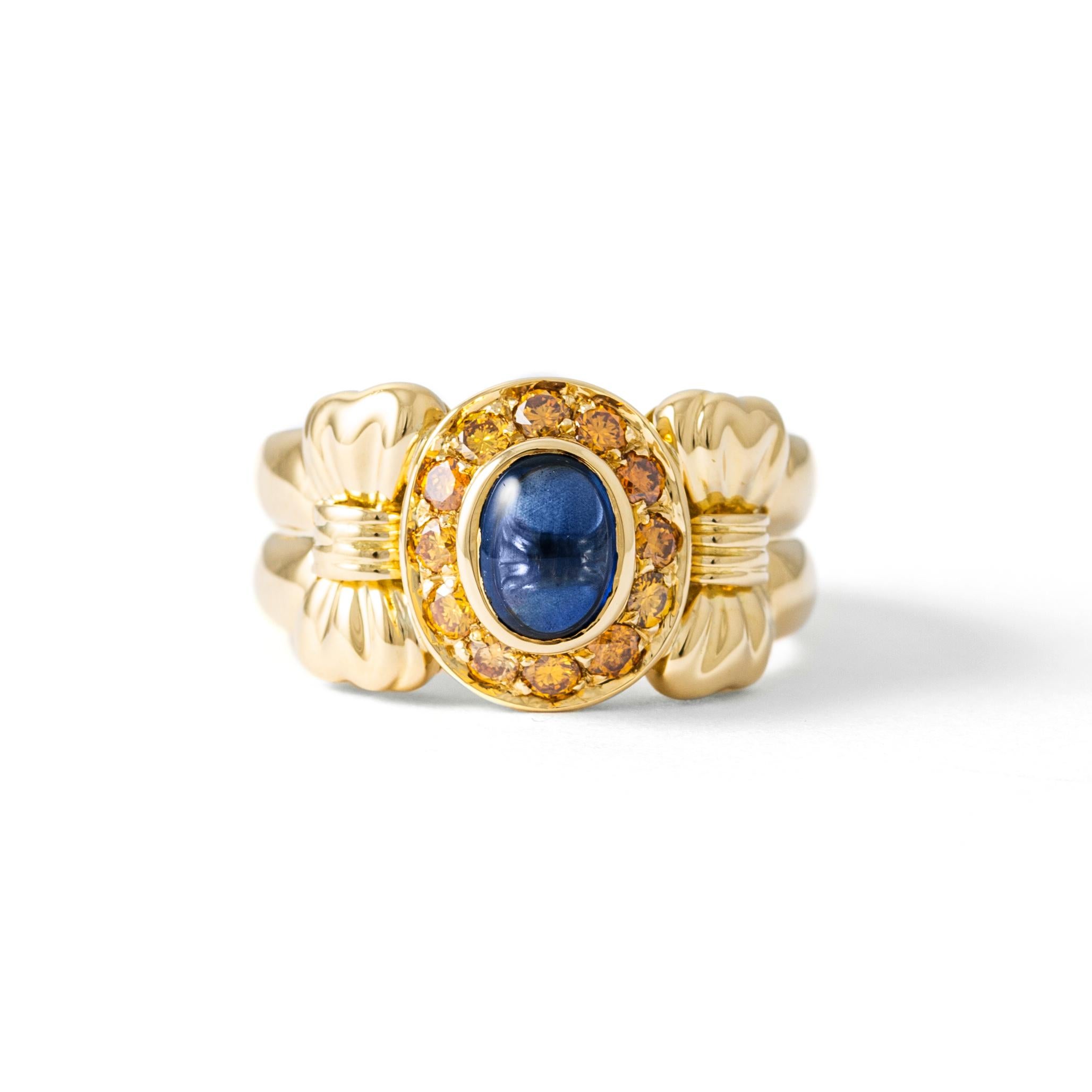 Ring in 18kt yellow gold set with one cabochon cut sapphire 1.32 cts and 12diamonds 0.44 cts Size 53