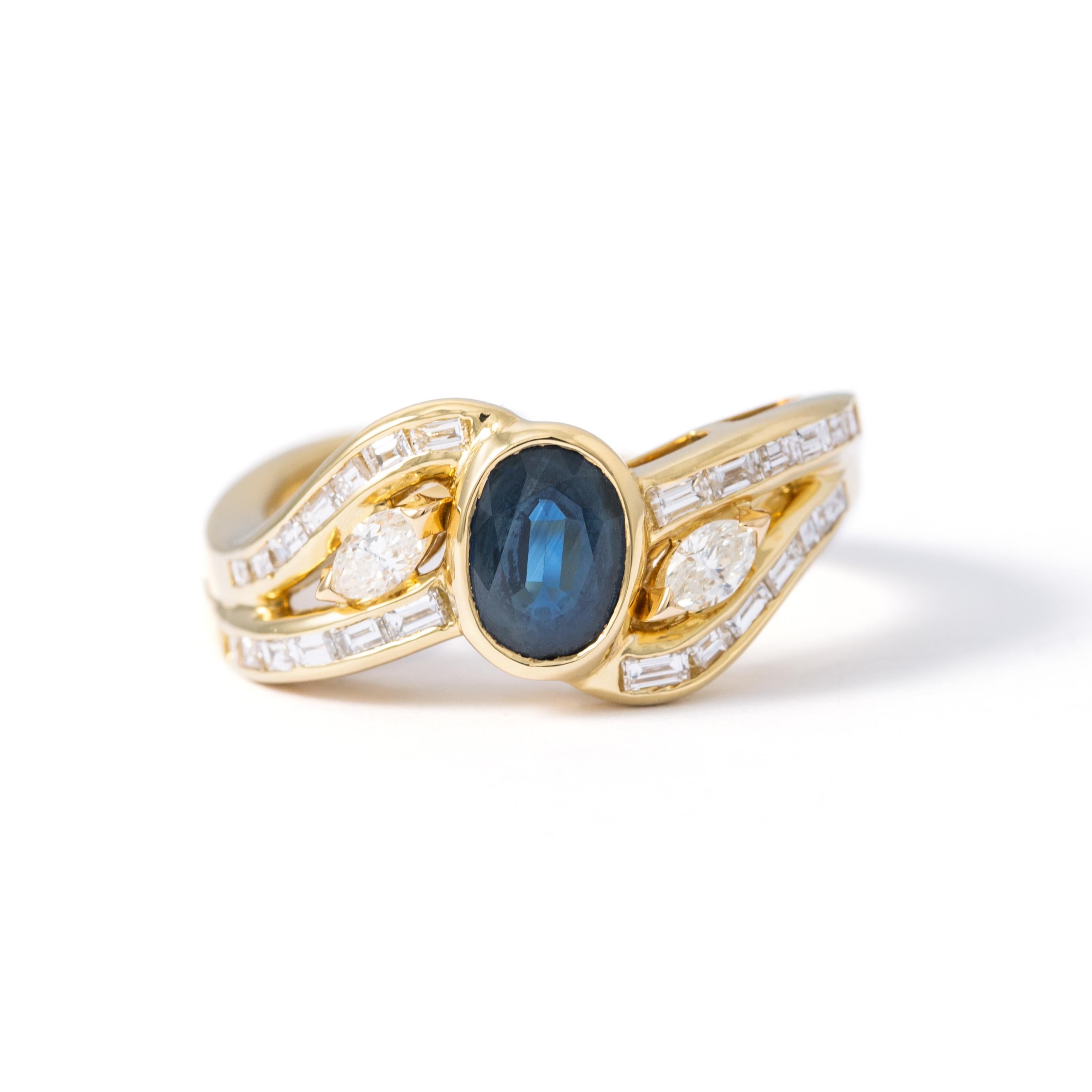 Ring in 18kt yellow gold set with one oval cut sapphire 1.01 cts, 2 oval cut diamonds 0.18 cts and 25 square diamonds 0.46 cts Size 52