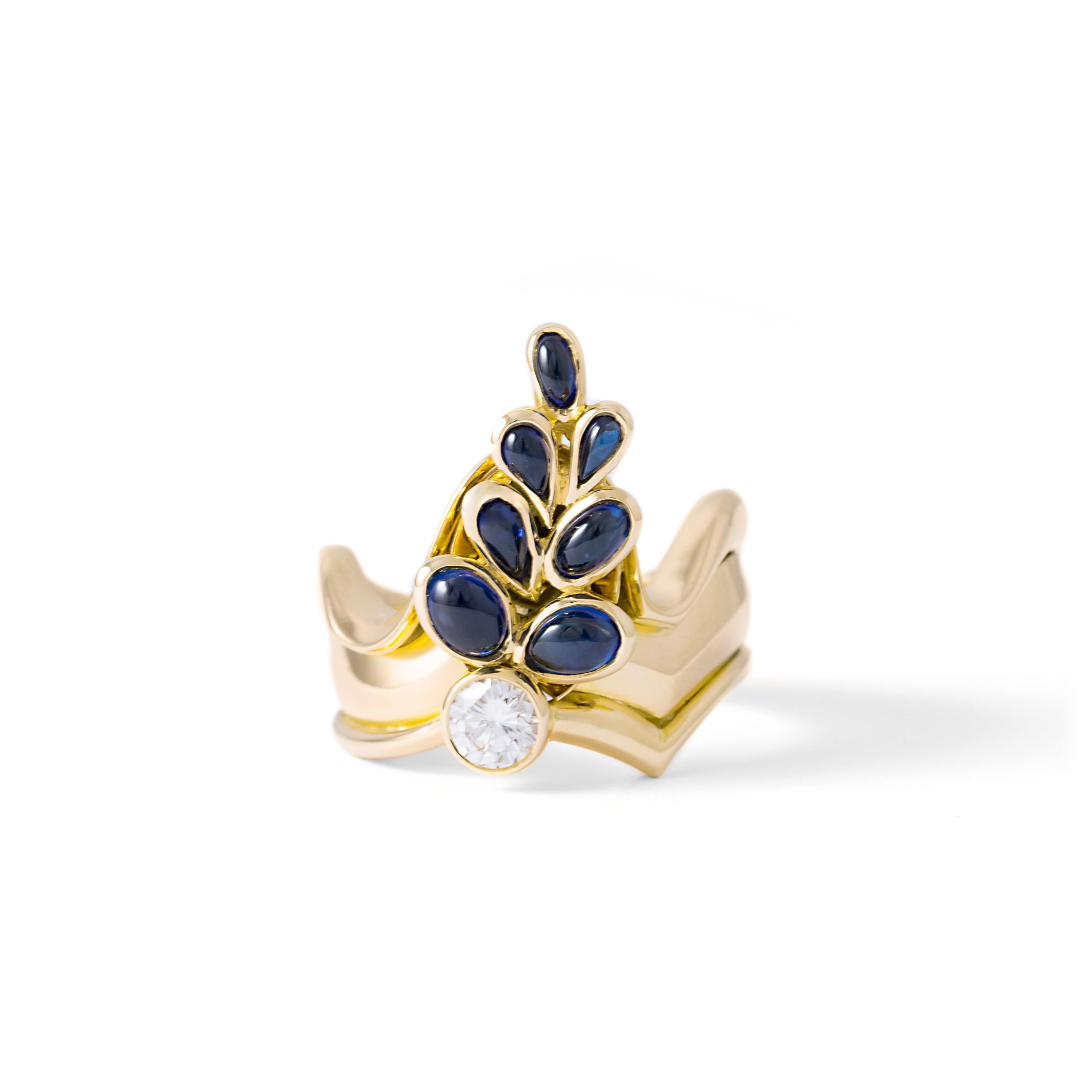 Ring in 18kt yellow gold set with 7 cabochon cut sapphires 1.60 cts and one diamond 0.030 cts
Size 53       