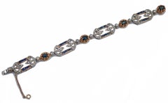 Zaffiri, diamanti, oro rosa 14 carati e bracciale in argento.