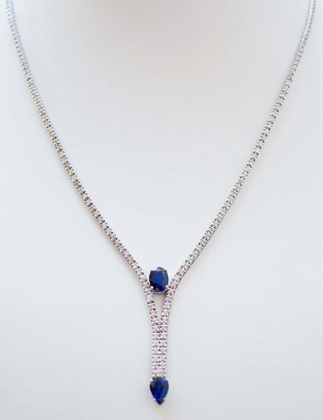 Elegant tennis necklace in 14 kt white gold structure mounted with diamonds for all the length; between two rows of diamonds, an oval sapphire and, as pendant, a drop sapphire.
Diamonds 2.83 ct
Sapphires 2.77 ct
Total Weight 14.30 gr
RF  ++GAGFG
RK.