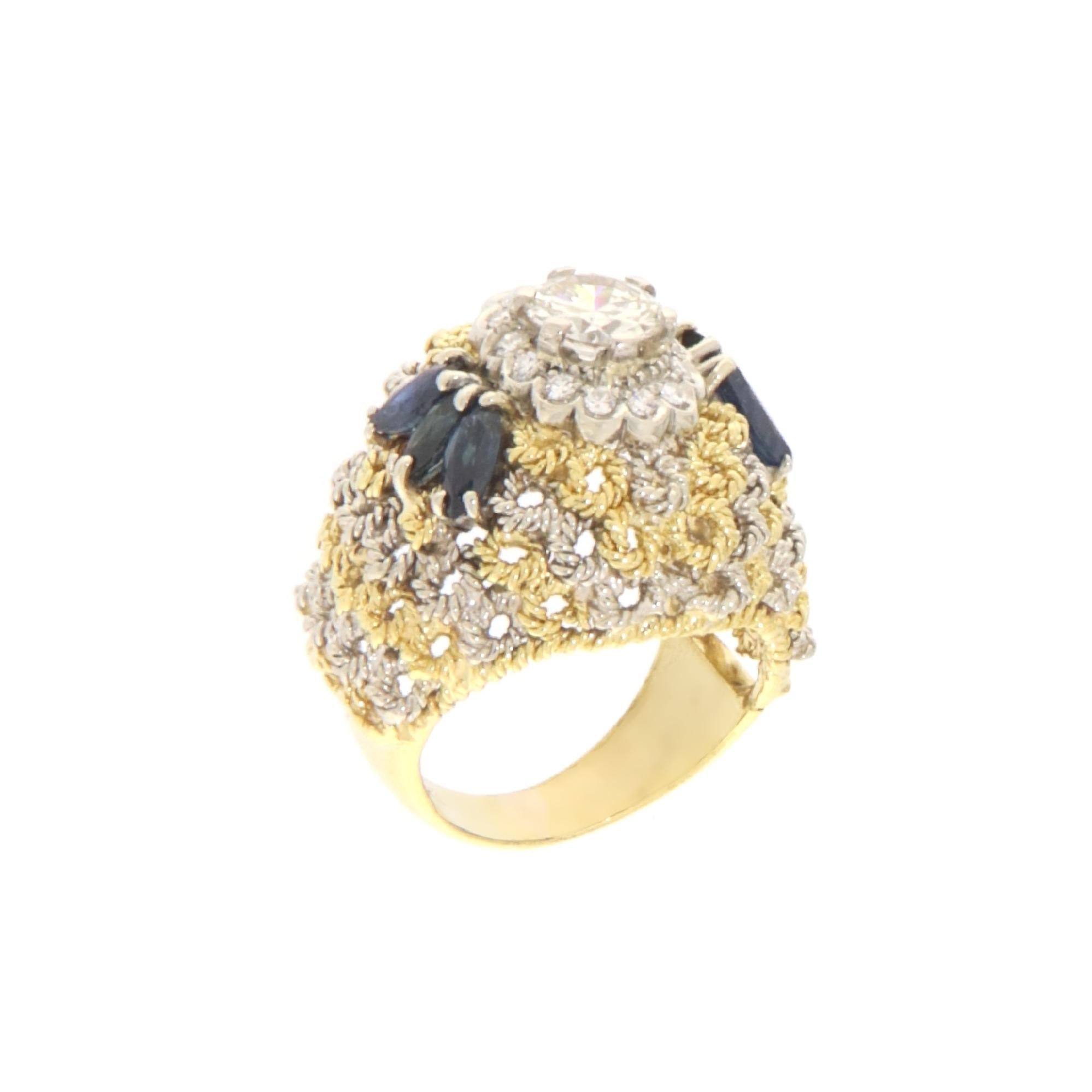 This exquisite ring is a fine example of luxury and elegance, crafted from 18-karat white and yellow gold. It features a central brilliant-cut diamond weighing 0.84 carats, surrounded by a halo of smaller diamonds that enhance its luminous appeal.