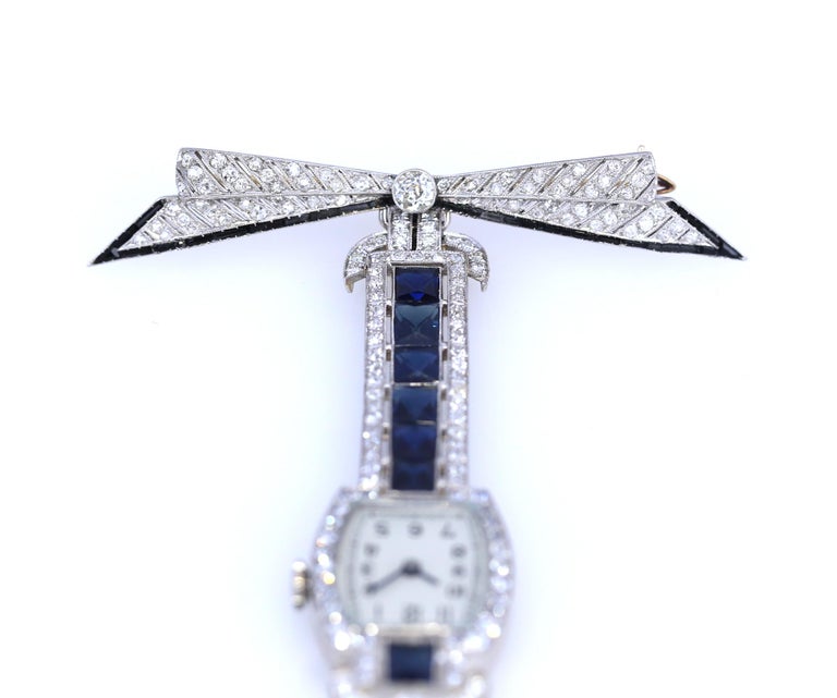 Round Cut Sapphires Diamonds Onyx Platinum Swiss Brooch Watch Published, 1920 For Sale