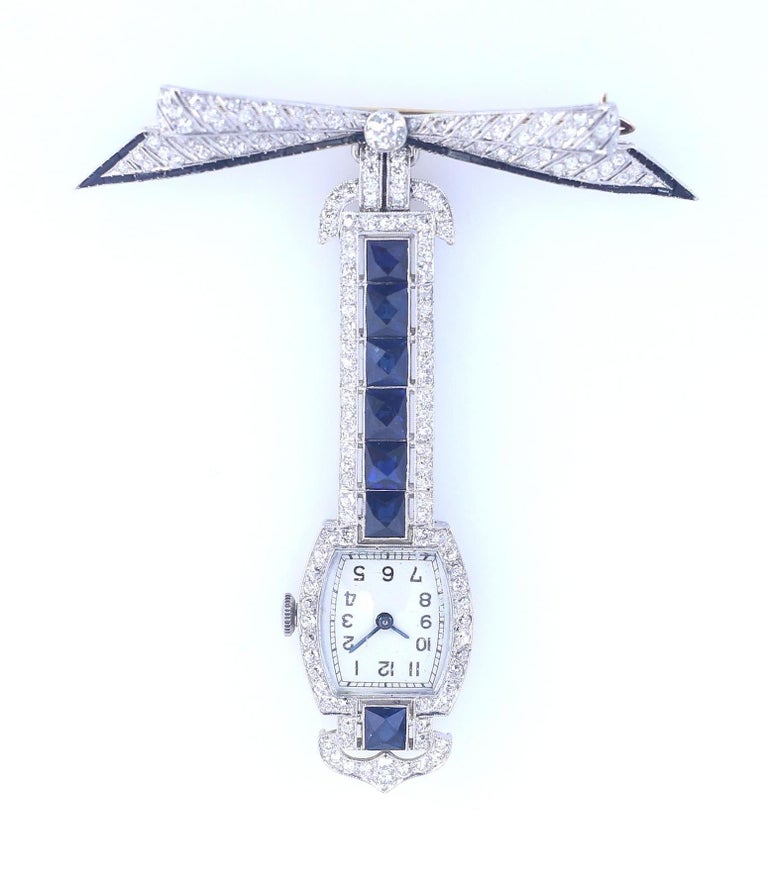 Sapphires Diamonds Onyx Platinum Swiss Brooch Watch Published, 1920 For Sale