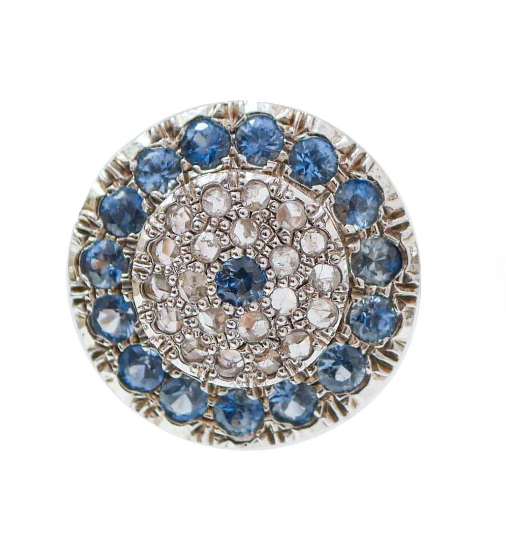 Simple earrings in 9 kt rose gold and silver structure mounted with a central sapphire surrounded by a frame of diamonds and sapphires.
These earrings were totally handmade by Italian master goldsmiths and they are in perfect conditions.
Diamonds