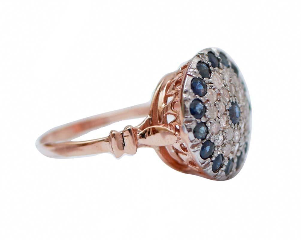 Beautiful retrò ring in 9 kt rose gold and silver structure mounted with a sapphire in the central part surrounded by diamonds  and sapphires.
This ring was totally handmade by Italian master goldsmiths and it is  in perfect conditions.
Diamonds