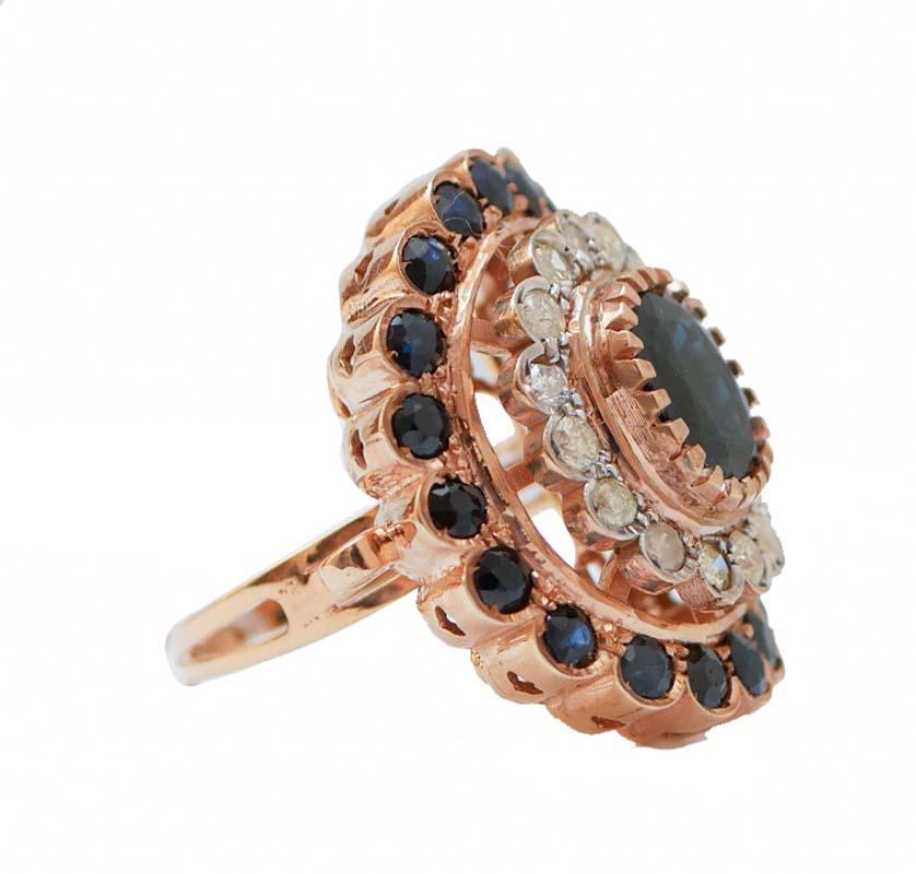 Amazing ring in 9 kt rose gold and silver structure mounted with a central sapphire surrounded by a crown of diamonds and sapphires.
This ring was totally handmade by Italian master goldsmiths and it is in perfect conditions.
Diamonds 1.23