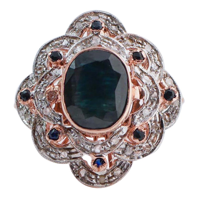 Anello con zaffiri, diamanti, oro rosa e argento.