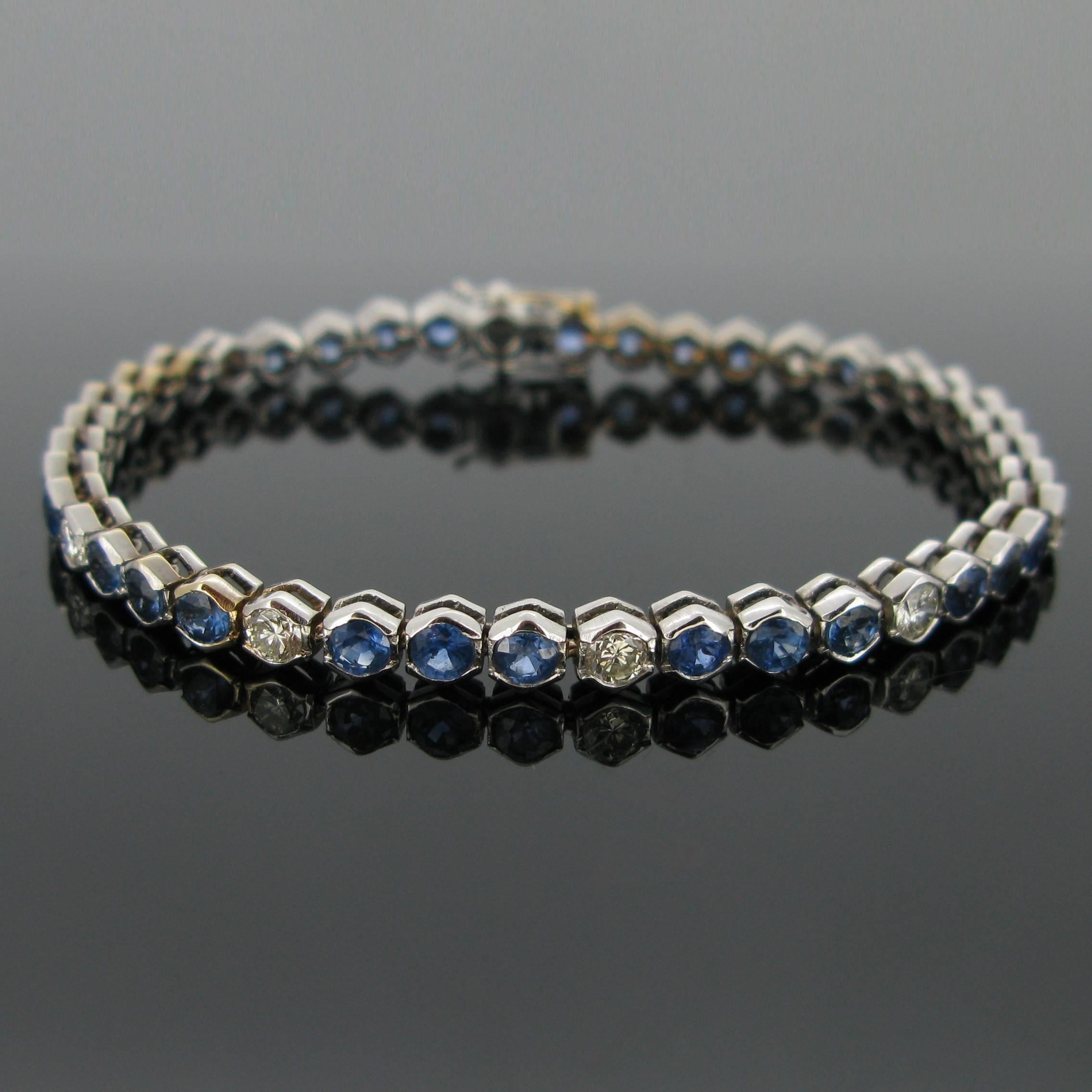 A sapphires and diamonds tennis bracelet. This timeless line is set with 10 brilliant cut diamonds (tcw : 1,20ct approximately) and with 32 sapphires for a total weighing around 6,40ct.  
The name Tennis Bracelet is related to a professional tennis