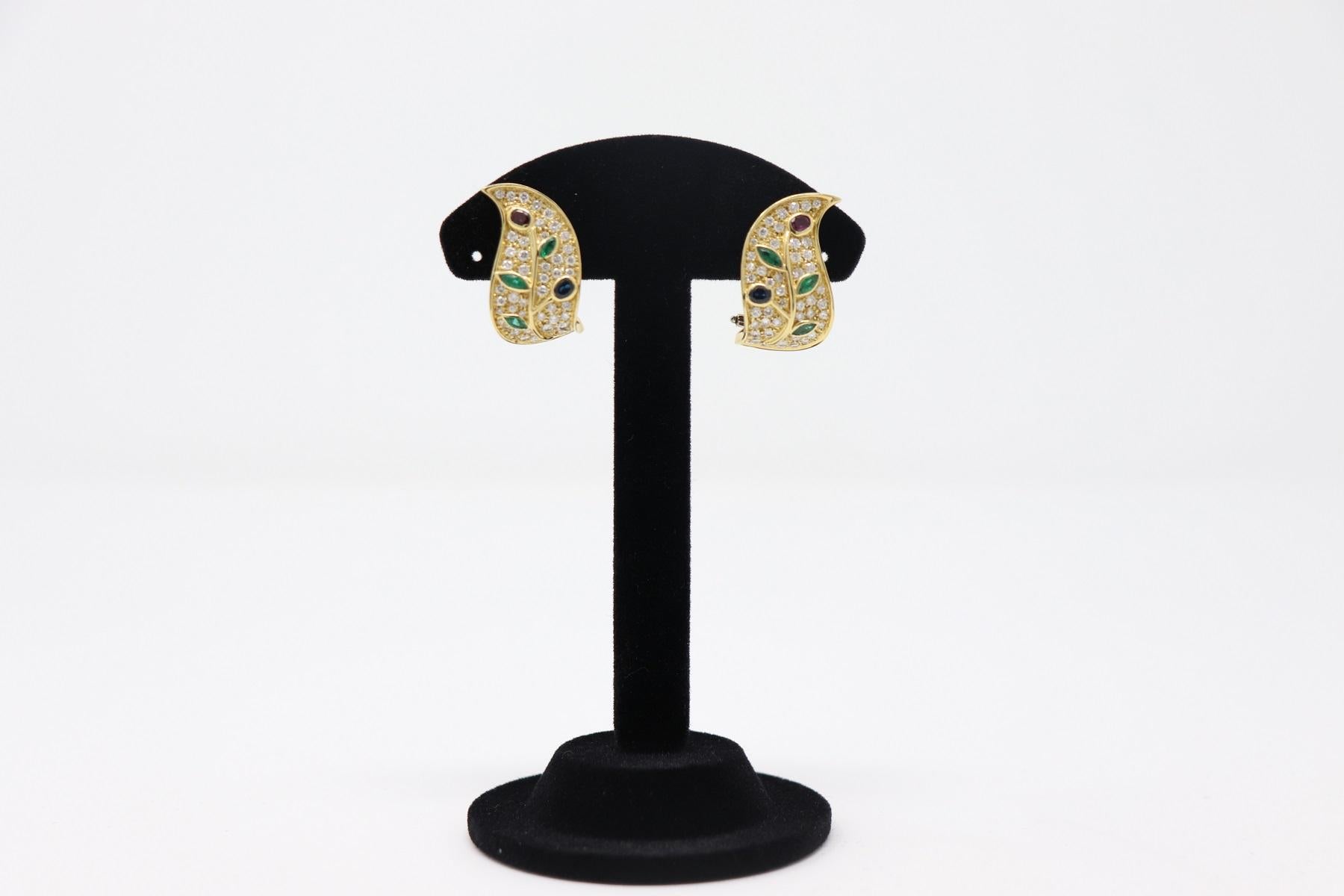18 Karat yellow gold fashion drop earring with 0.25 Carat brilliant cut diamonds and various untreated stones Sapphires Emerald and Ruby. 
Total weight: about 18.50 g.
New contemporary jewelry. Produced in the famous Italian city of gold Valenza.