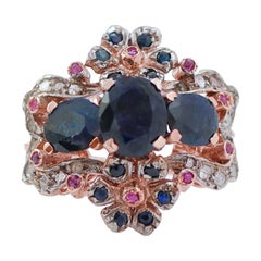 Sapphires, Rubies, Diamonds, Rose Gold and Silver Ring.