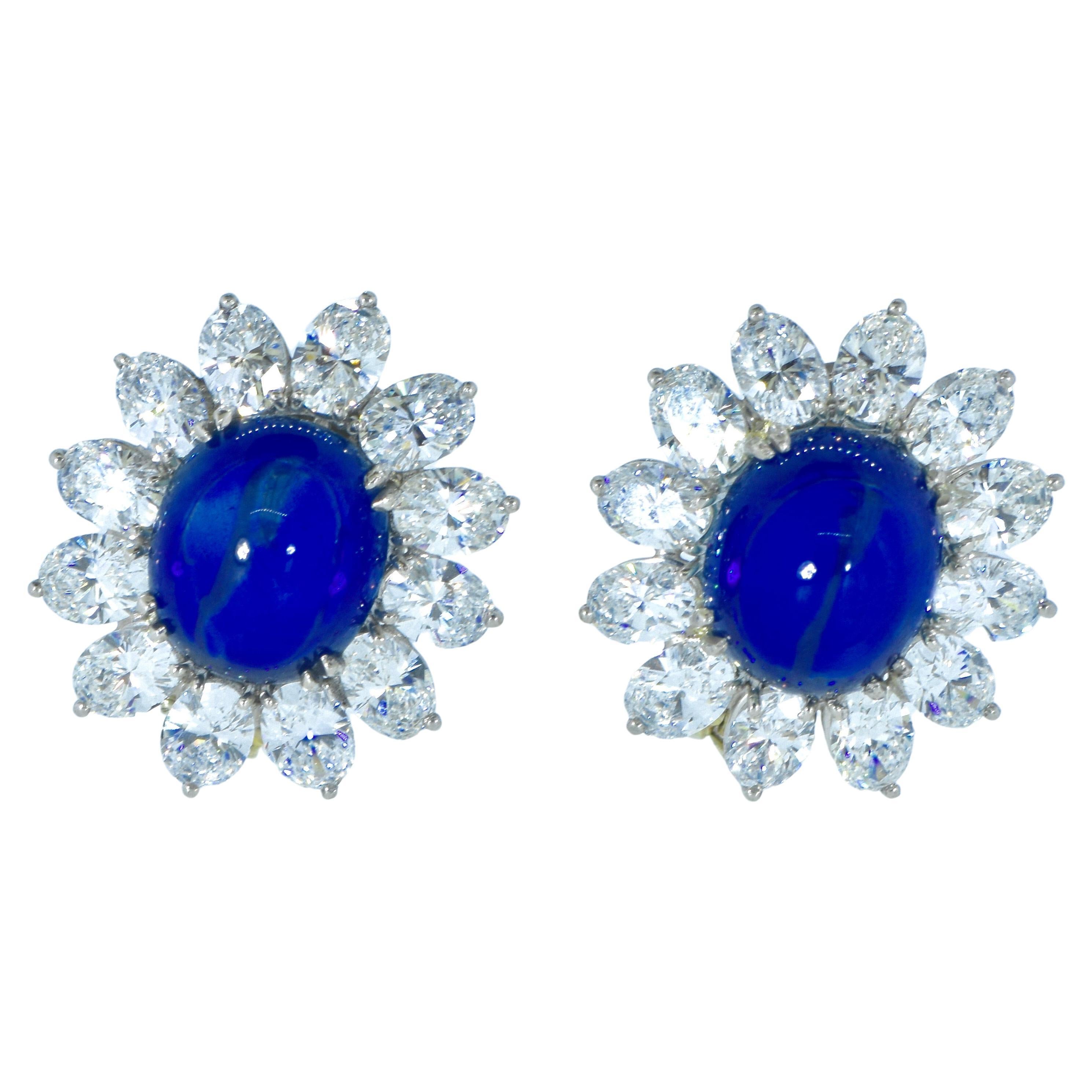  GIA certified natural sapphires, weighing exactly 9.67 cts., and 7.10 cts.,  are set off by fine white round brilliant cut diamonds.  The oval sapphires are a high cabochon cut, well matched, display a rich blue color and are very slightly