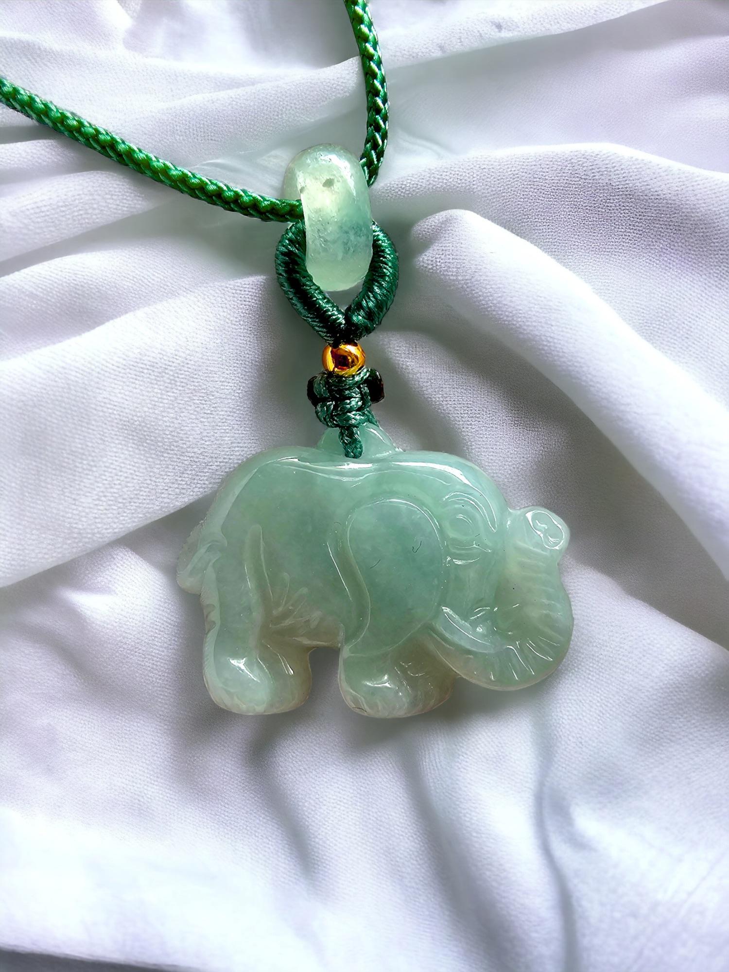 Sapporo Burmese Green A-Jadeite Elephant Pendant Necklace with FYORO String

Using Handpicked high translucency and carved natural Burmese A-Jadeite. We created an elephant design with inspiration notes from Sapporo, Japan. We allow the natural hues