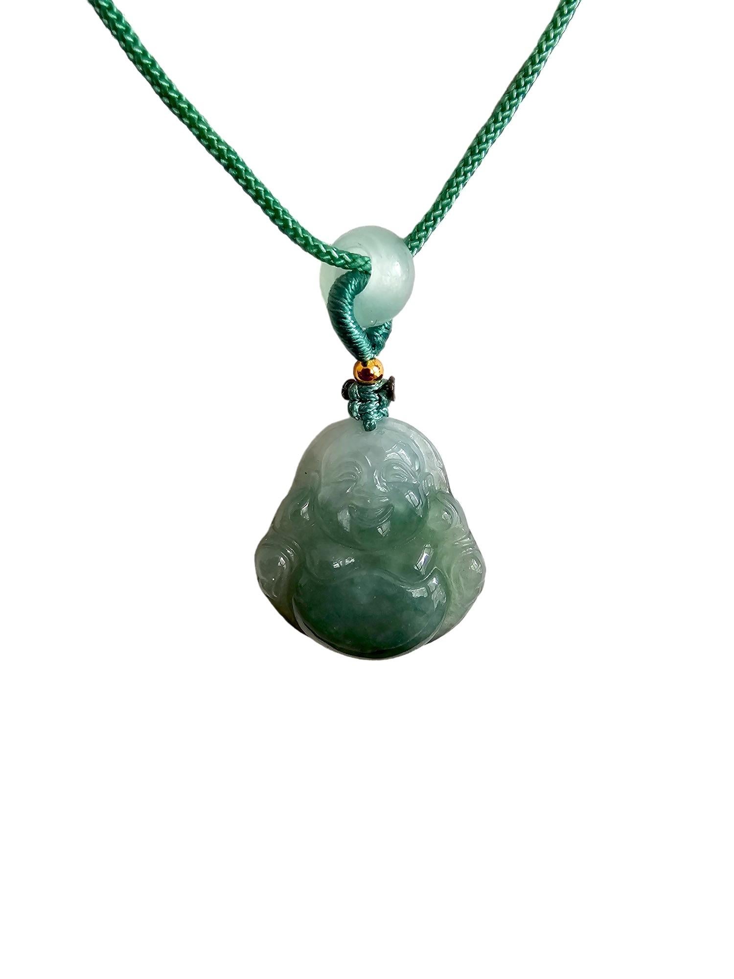 Sapporo Burmese Green A-Jadeite Laughing Buddha Pendant Necklace with FYORO String

Using Handpicked high translucency and carved natural Burmese A-Jadeite. We created a Laughing Buddha design with inspiration notes from Sapporo, Japan. We allow the