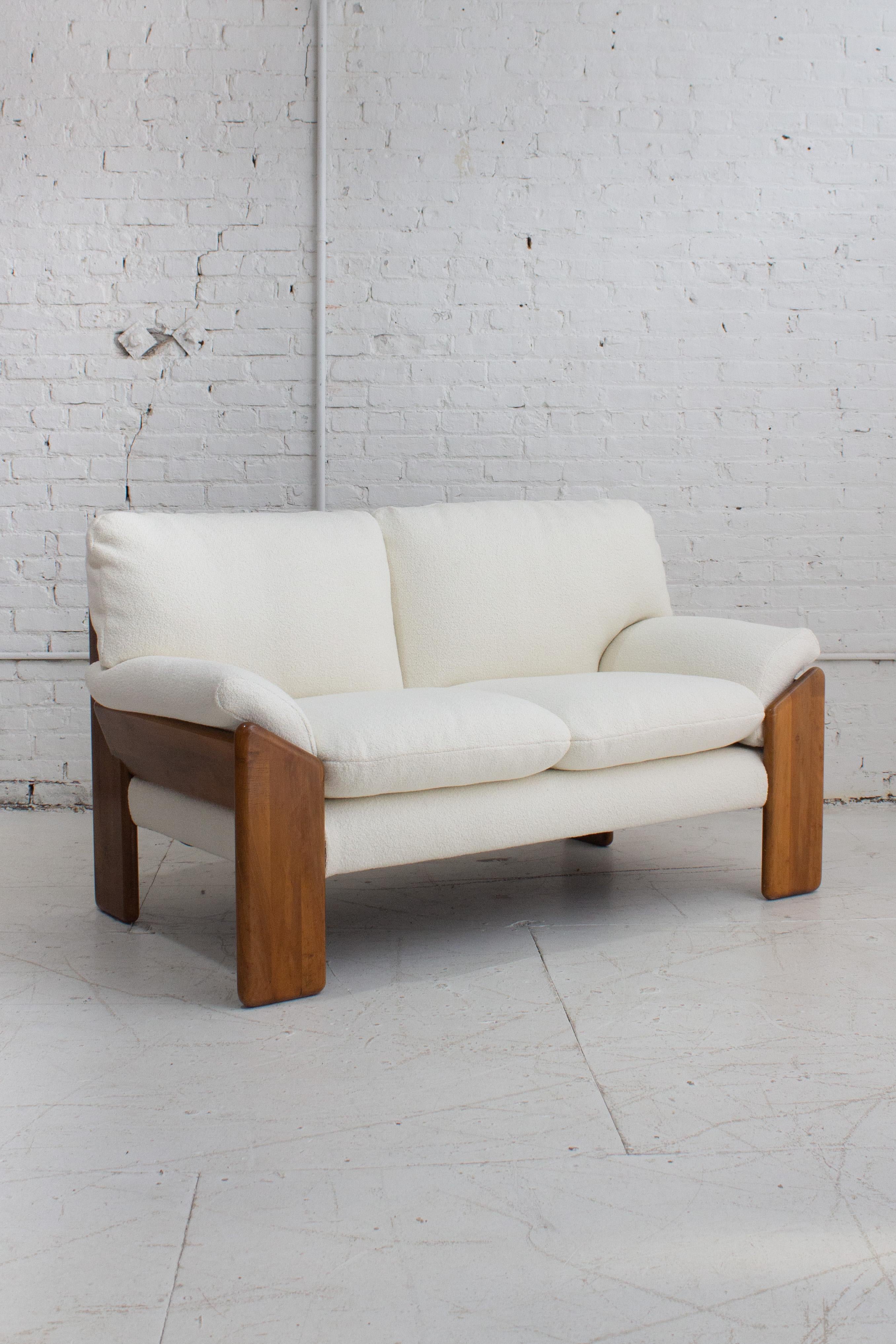 A 'Sapporo' two seat sofa designed by Mario Marenco for Mobil Girgi. A solid wood frame holds six removable cushions. Newly reupholstered in a textured cream fabric. Stamped “Mobil Girgi.” Sourced in Northern Italy.