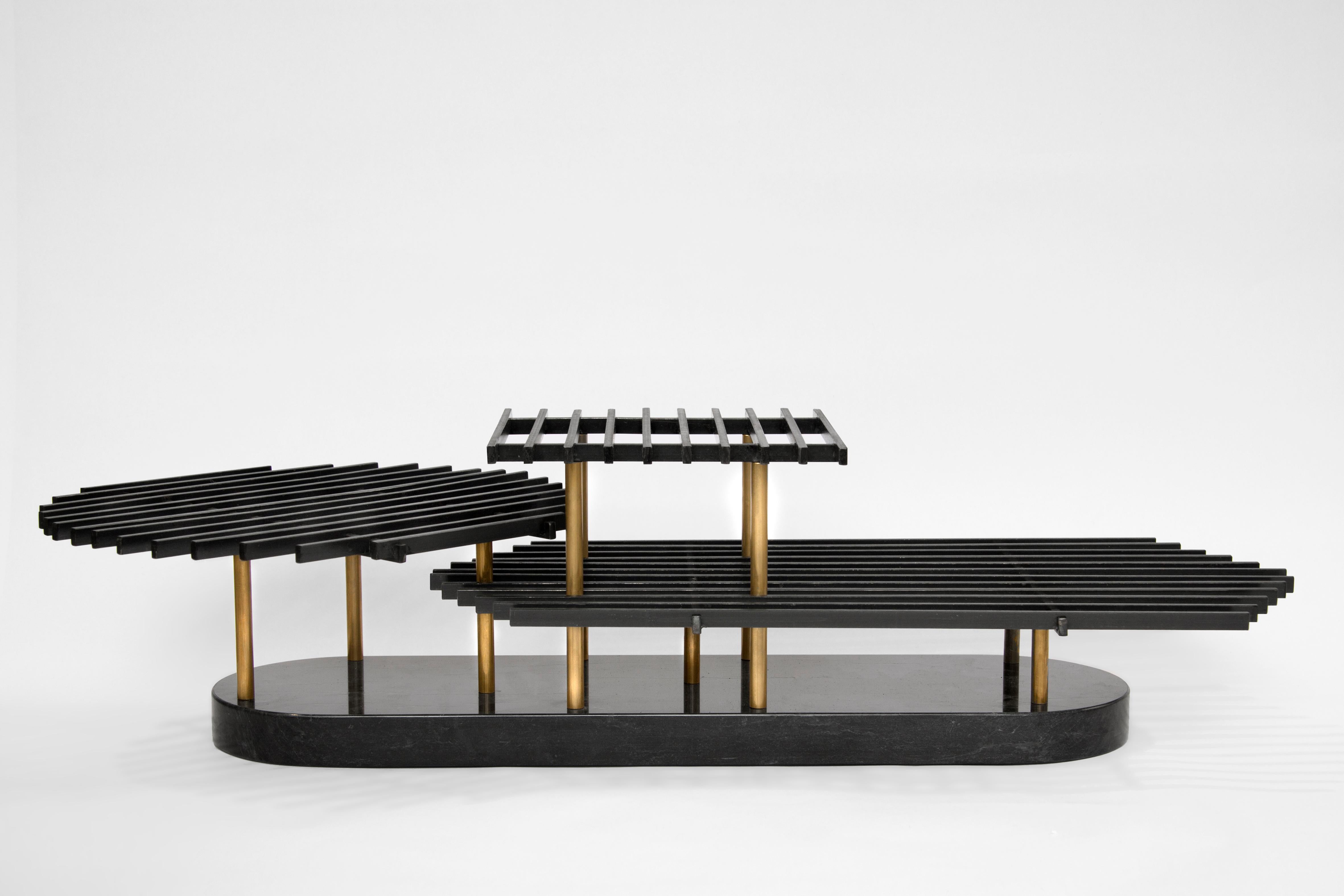 Saracinesca table podium by Oeuffice
Edition: 12 + 2AP
2013
Dimensions: 75 x 32 x 19 cm
Materials: Black oxide steel, solid brass and black marble of ormea

An overlapping collage of grids and planes inspired by the ornate detailing of
