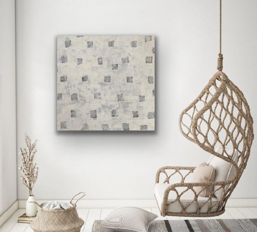 Gorgeous grey and white with a touch of blue layer in these abstract paintings.  Textured and shaded with multiple coats of paint for wonderful depth and dimension.     Sides are finished, creating the perfect view from any seat in the room. No need