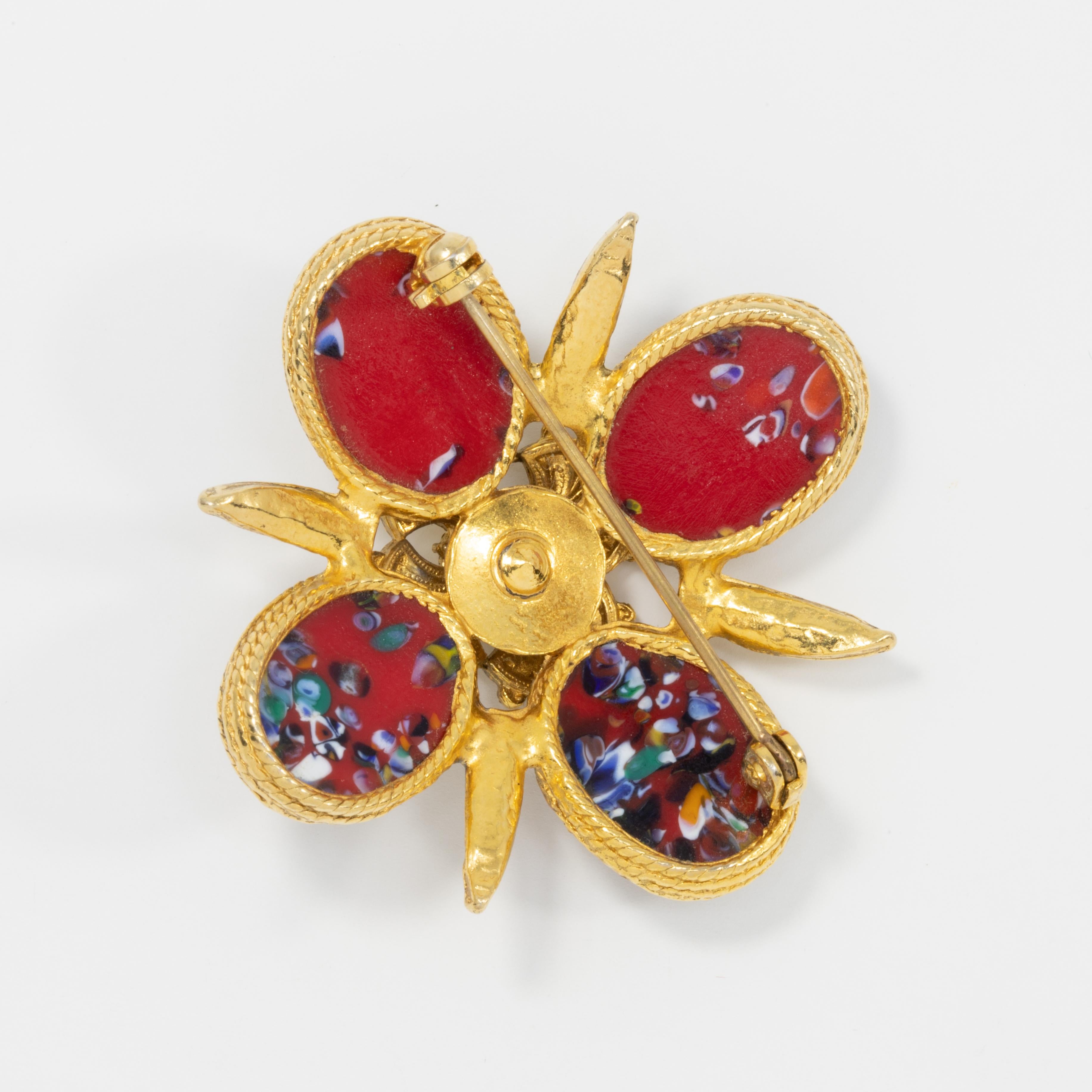 A stylish pin brooch by Sarah Coventry. Features red Easter cabochons set in a gold-plated Maltese cross setting. Featured in many vintage costume jewelry collection books.

Marks, Hallmarks, Signatures: None