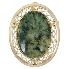 Sarah Coventry Pendentif broche en forme d'épingle en or 12 carats avec pierres précieuses vertes ouvertes au dos