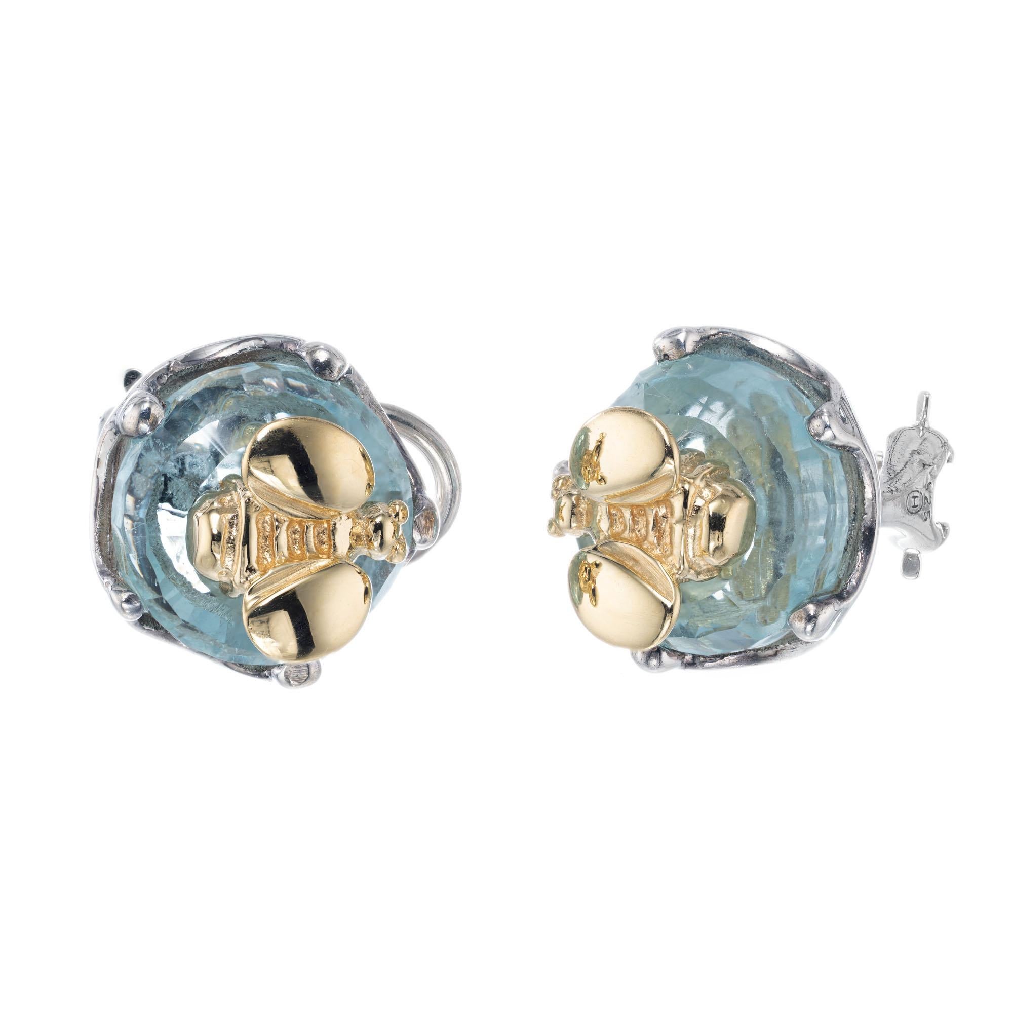 Aquamarine and bee earrings in 18k yellow gold and sterling silver from designer Saint by Sarah Jane.

2 round faceted cabochon aquamarine, approx. 10.00cts
18k yellow gold 
Sterling Silver
Stamped: 925 18k
Hallmark: Saint
12.1 grams
Top to bottom: