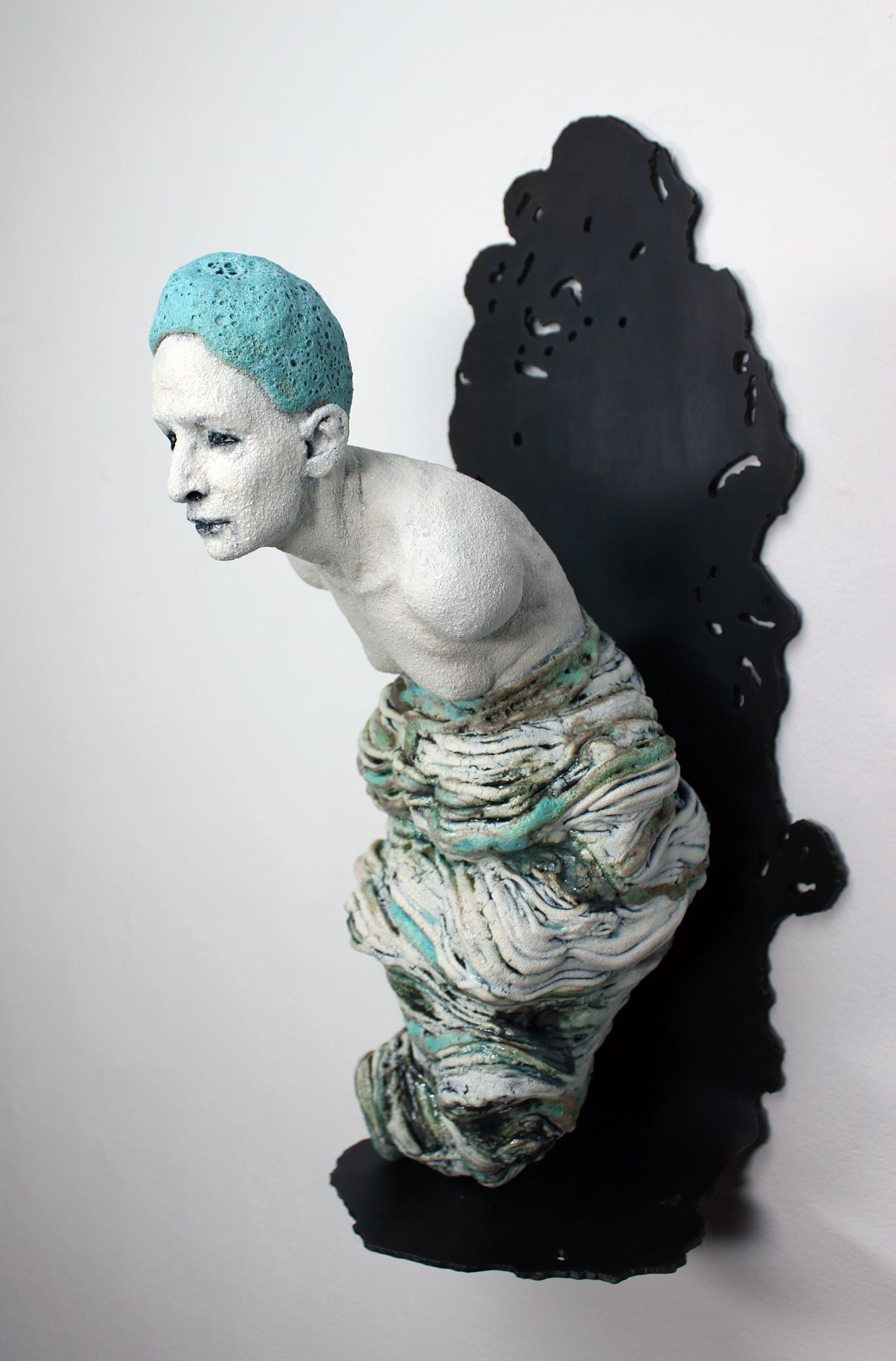 This blue, white, and grey figurative sculpture titled 
