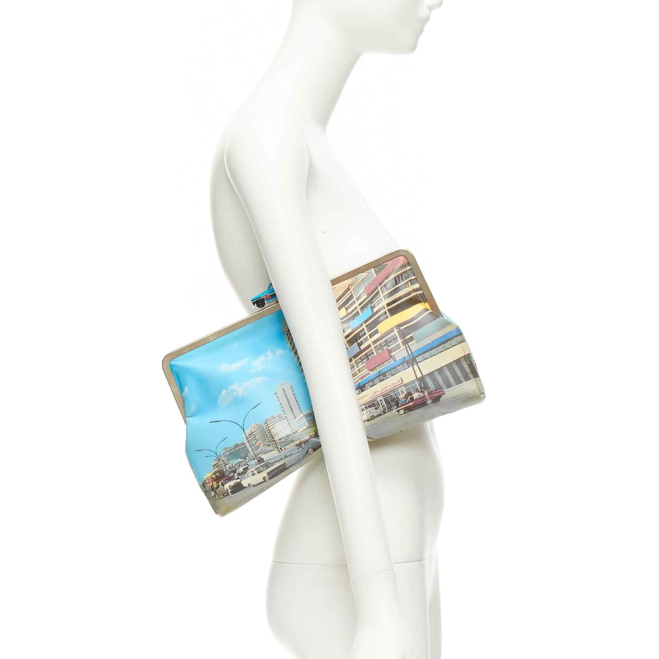 SARAH'S BAG blue vintage car clasp street print canvas silver frame clutch bag
Reference: NKLL/A00234
Brand: Sarah's Bag
Material: Canvas, Metal
Color: Multicolour, Blue
Pattern: Photographic Print
Closure: Push Clasp
Lining: Neon Yellow