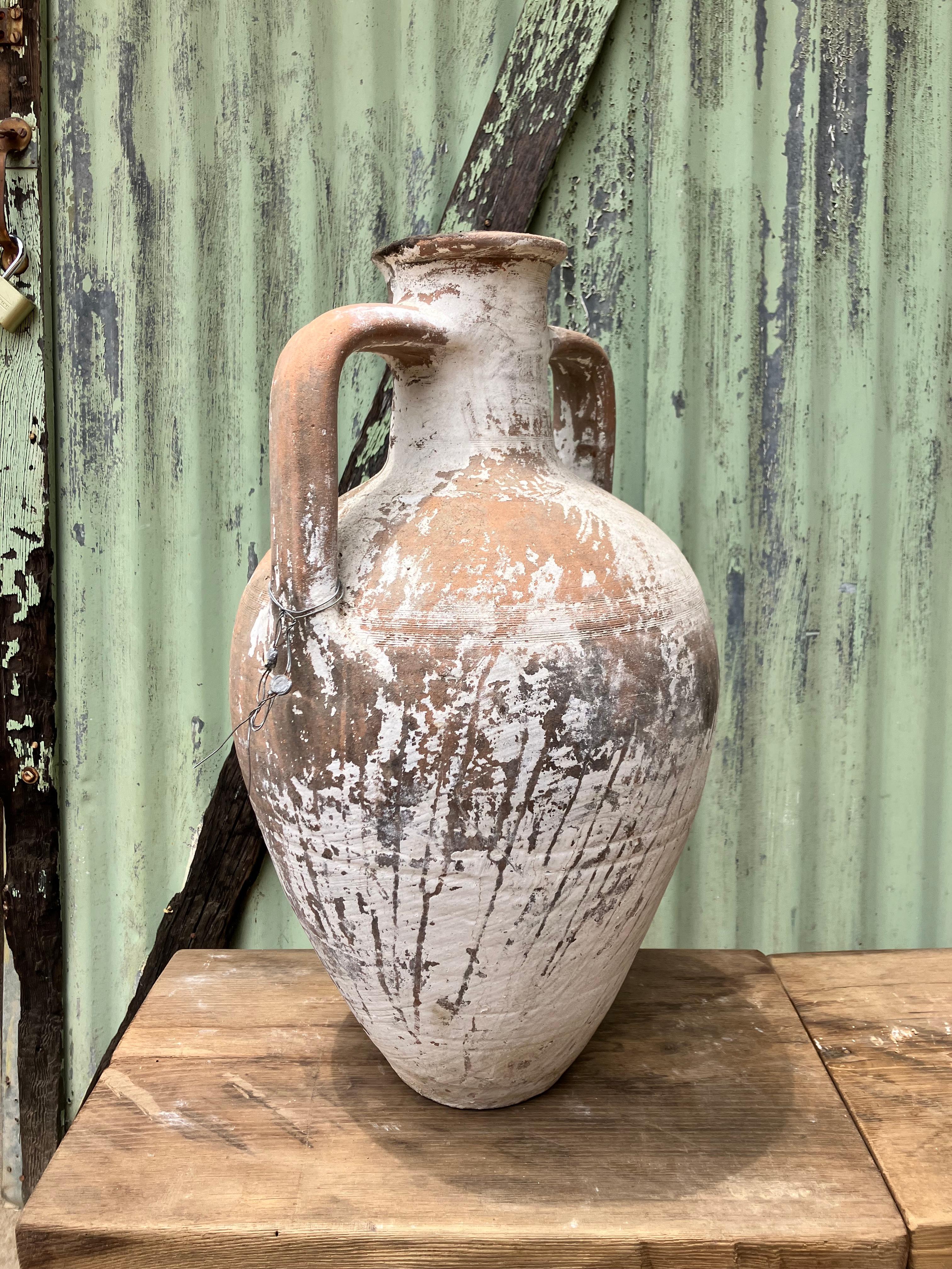 This large Turkish jug was used to store and serve liquids, likely wine, to generations of families in the Levant.  

Wine production in Anatolia can be traced back to the Hittites: ancients who called the region home from 1600-1200 BCE. They