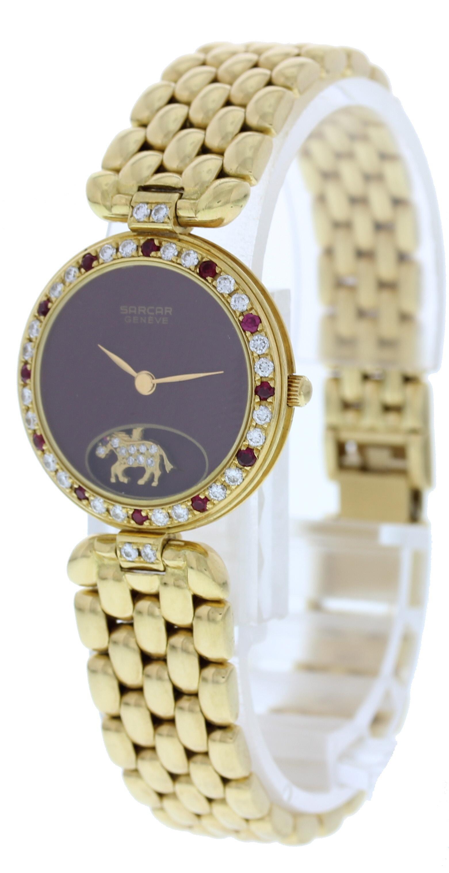 Sarcar Geneve 18k Yellow Gold Ladies Watch. 18K yellow gold 25mm case. Gold bezel with factory set diamonds and rubbies. Dark red dial with gold hands. Yellow gold moving horse encrusted with diamonds and a ruby. Gold bracelet will fit a 6 inch