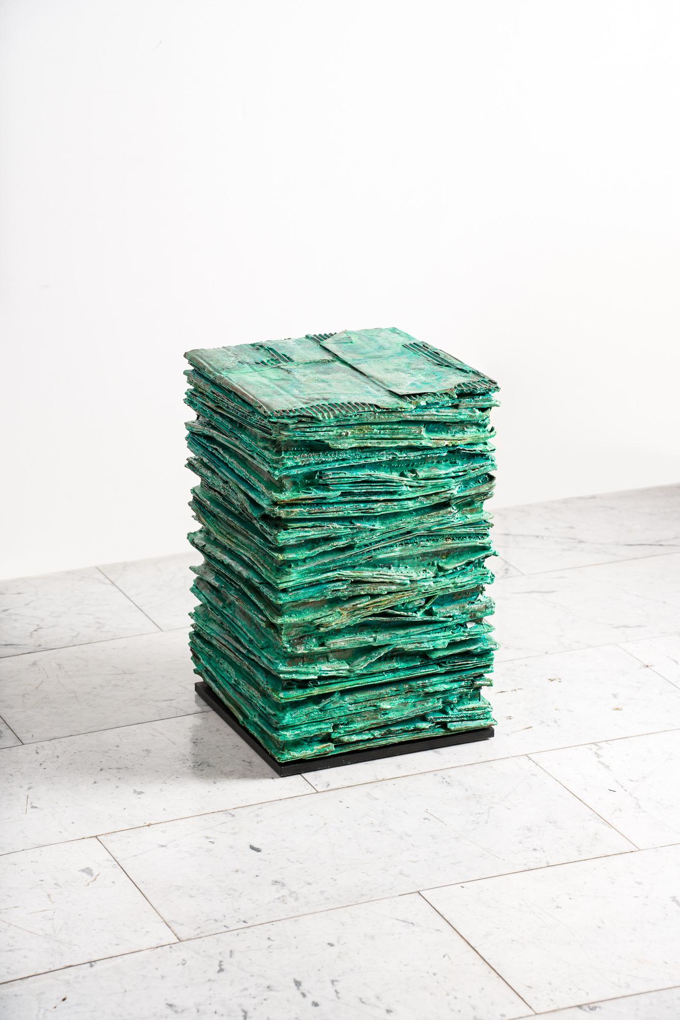 This item features cardboard, paper & resin with applied bronze and verdigris patina satin. Design partners Joseph Cleghorn and Connor Moxam began working together in 2016, developing a reputation for the high level of engineering and craftsmanship